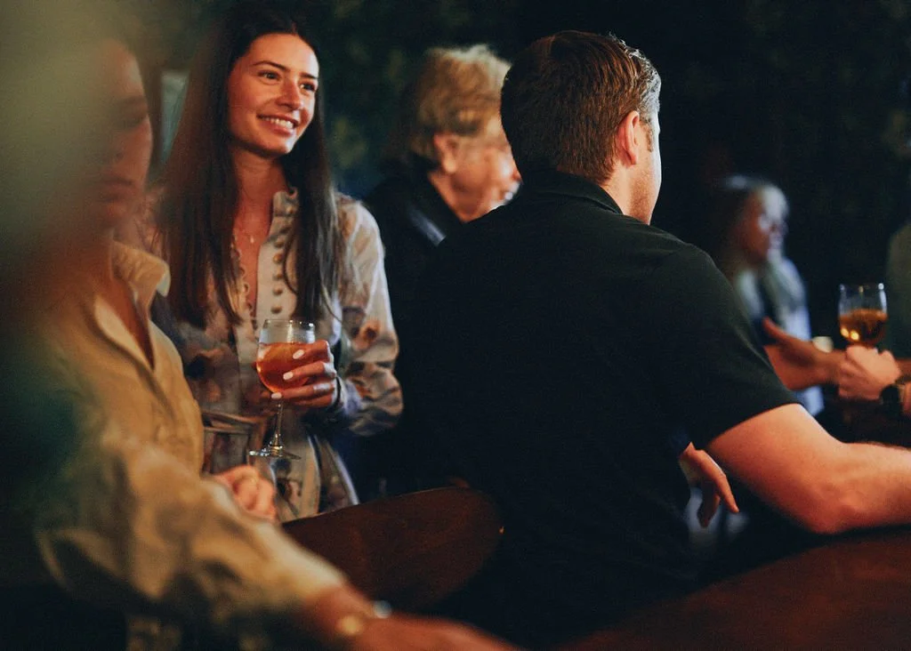 Guests enjoying drinks at the bar at The Tavern at Liberty Farms

