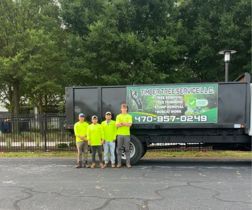 Timber Tree Services Group Picture In Front of Truck