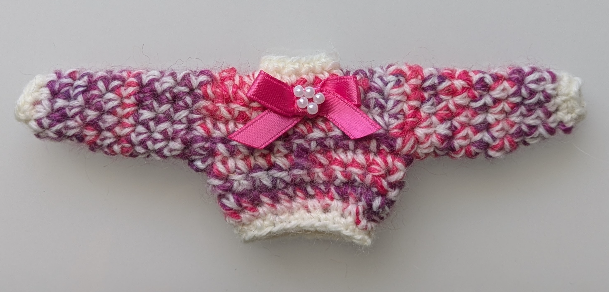 Pink, purple & white chunky Thumb Jumper with pink bow