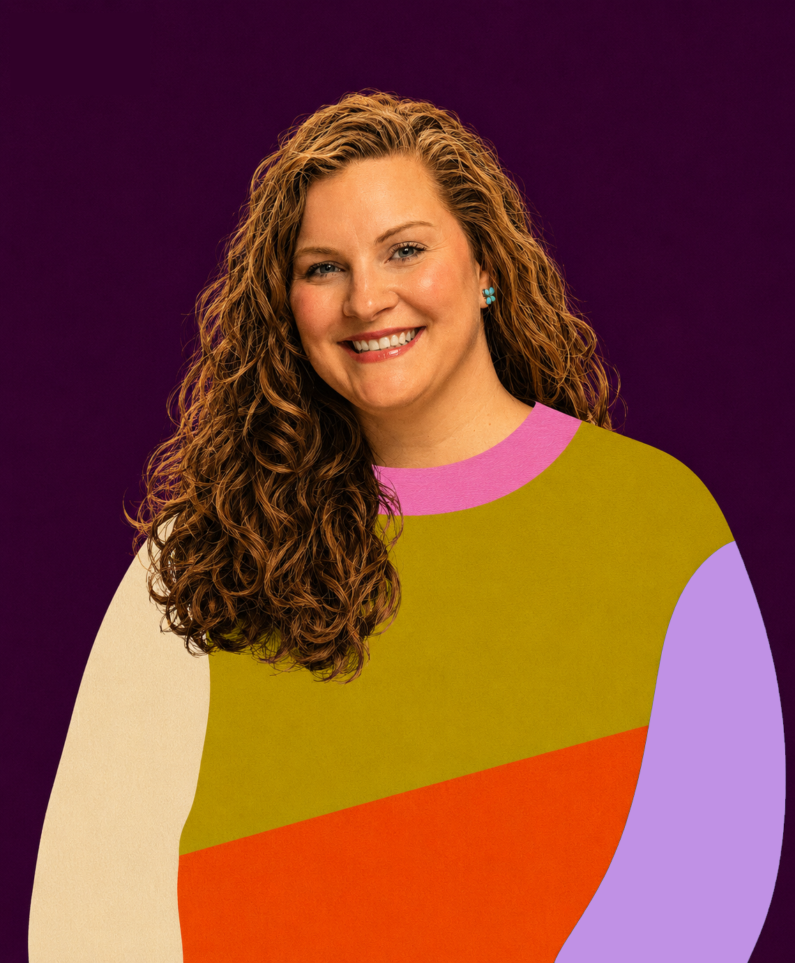 A woman with long curly hair, smiling, wearing a multicolored patchwork shirt against a purple background.