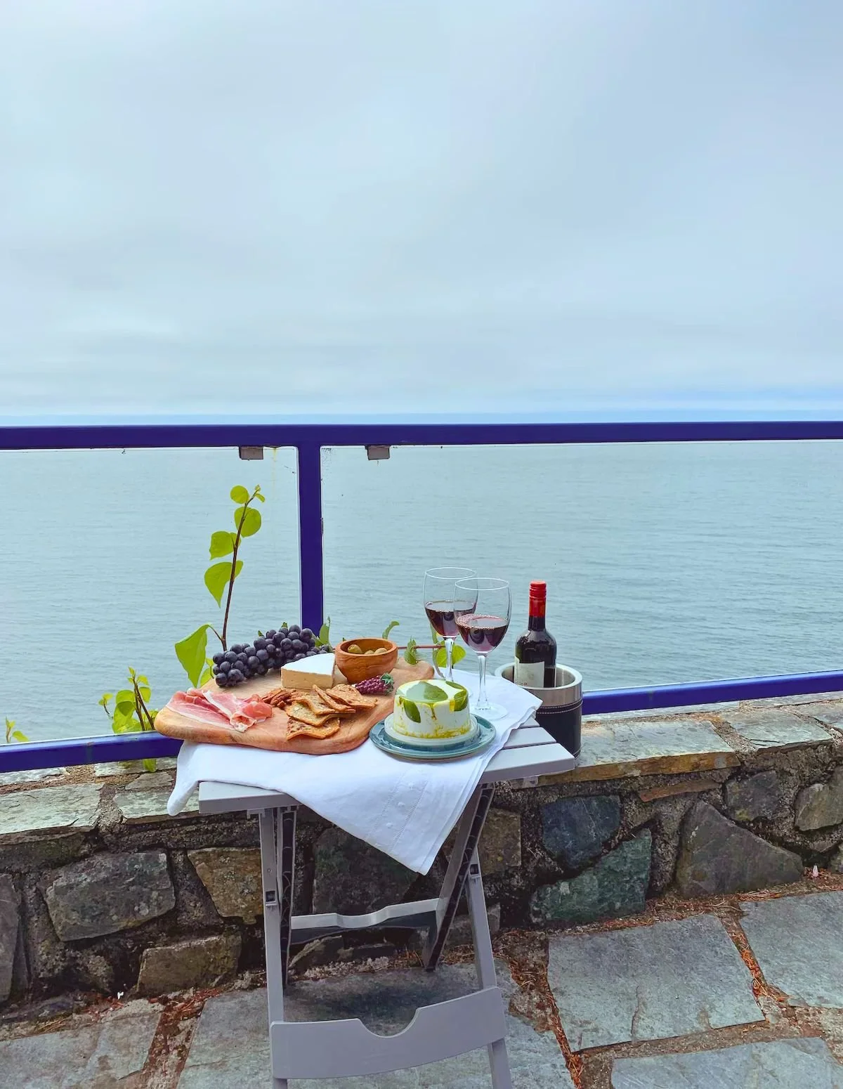 Lunch and view from balcony patio on a cloudy, Surfside Cottage, Sooke, BC