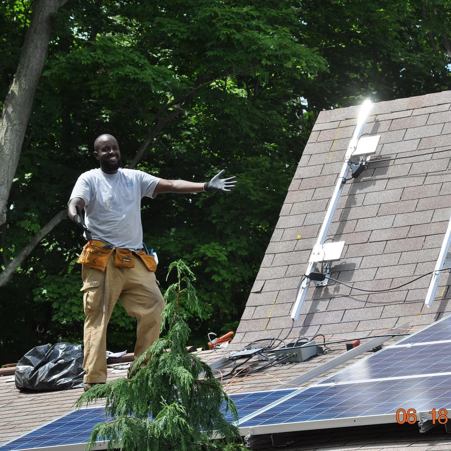 CEO Knowledge Murphy, installing a solar project in Greater Portland.