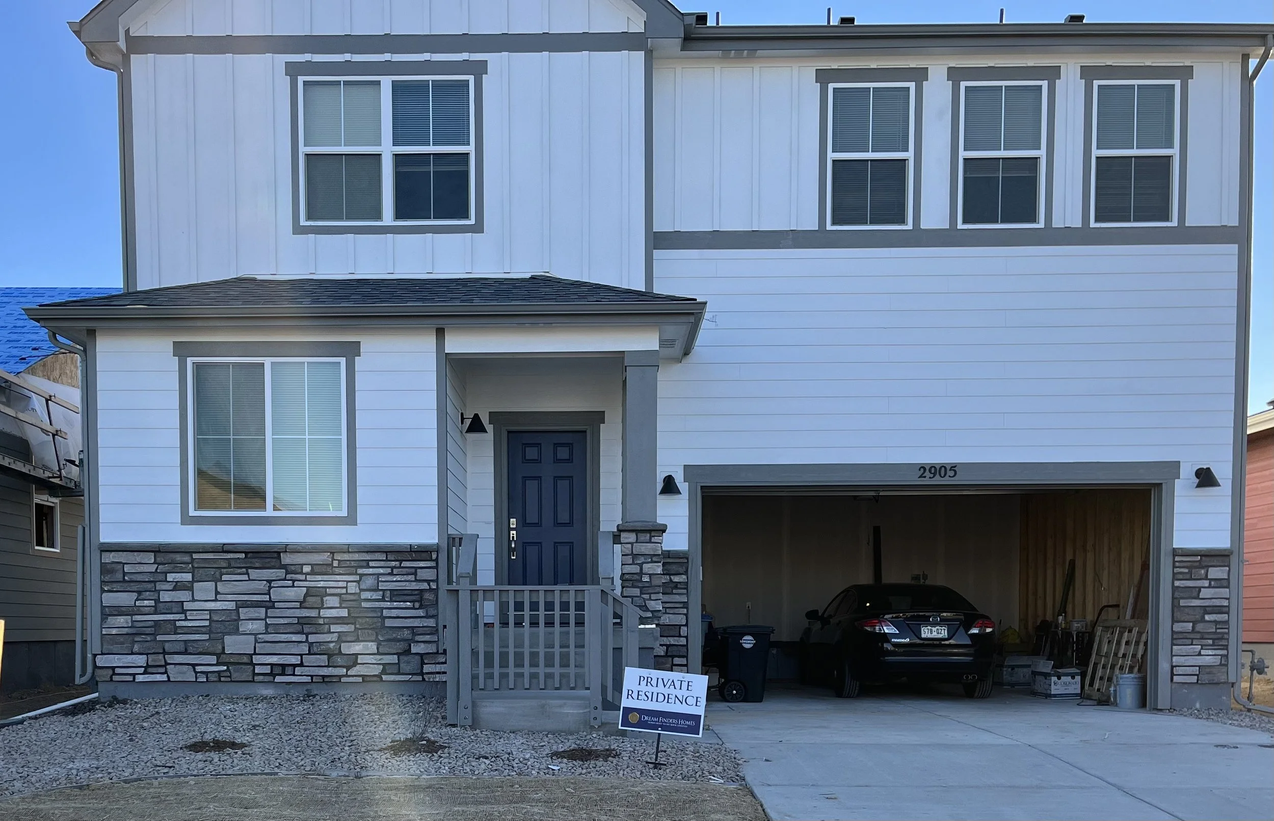 Siding removed, stone veneer and caps added 