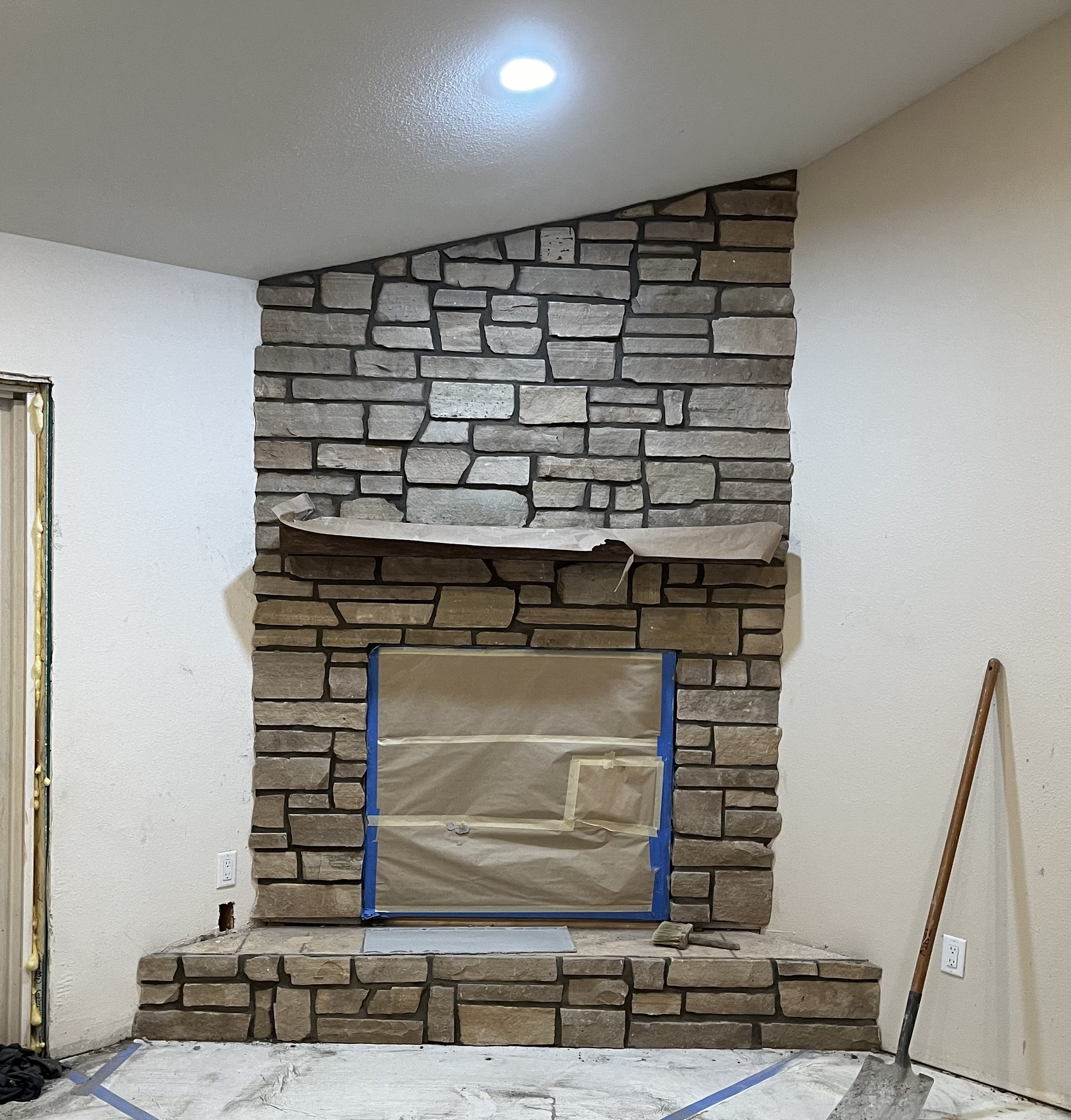buff flagstone veneer added to fireplace 