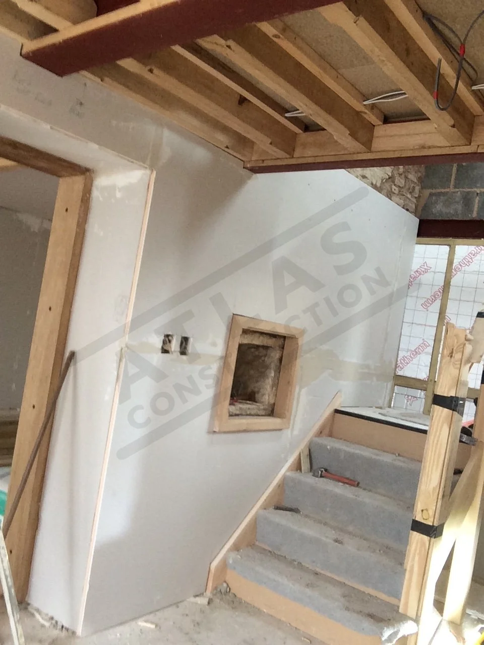 Installation of walls and stairs within barn conversion