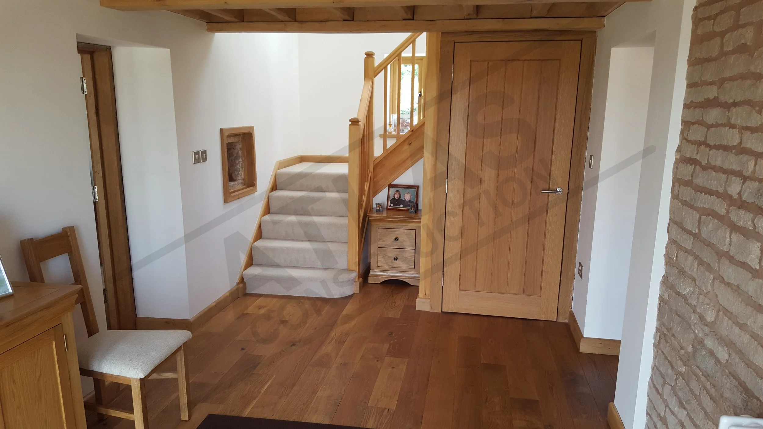 New install of oak entrance hallway including walls, doors, floors and skirting