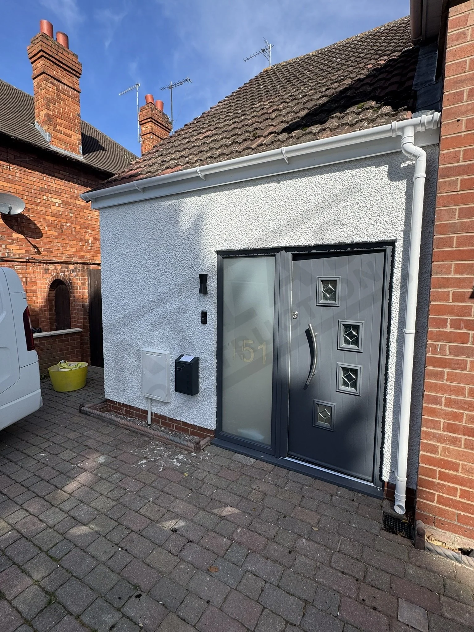 Replace old entranceway with new solid structure and doors