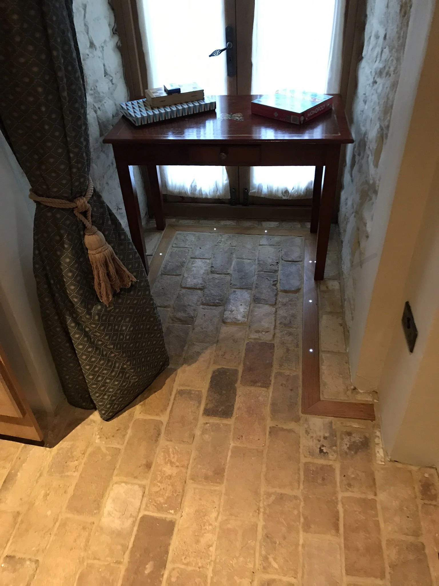 Clay brick floor with timber and LED light inlay