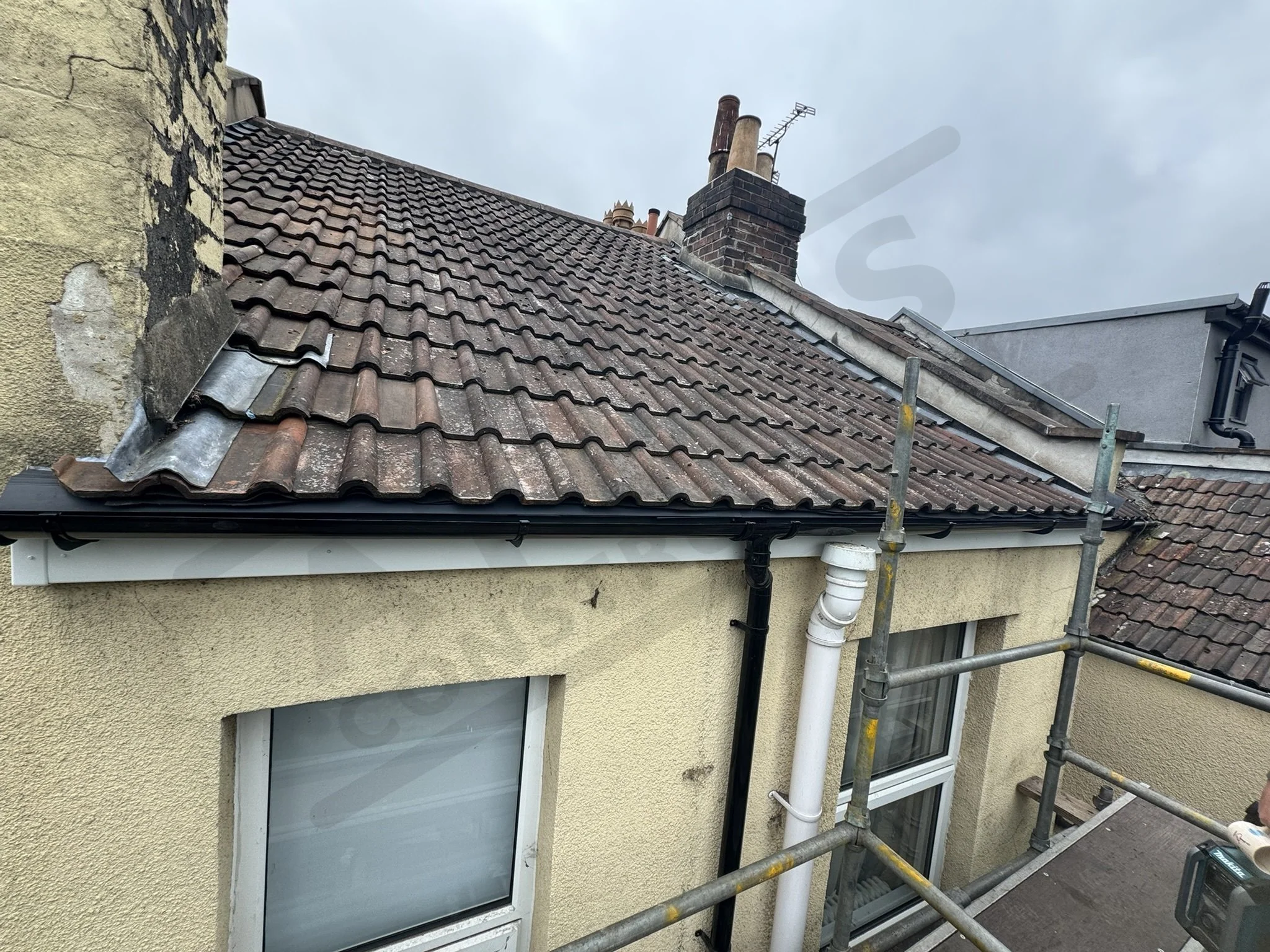 Roof repairs, re-felt and refit tiles. Renew fascia and gutters
