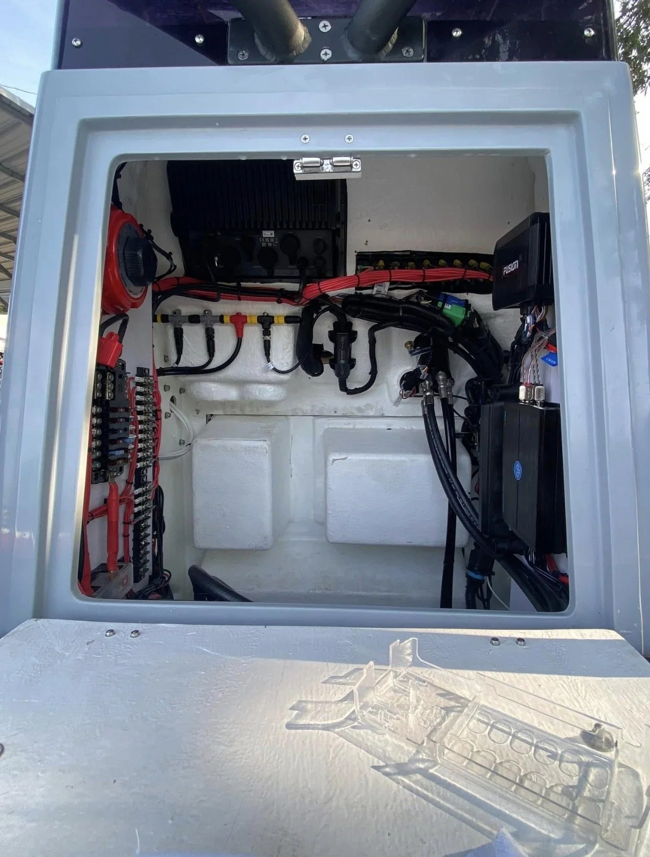 Open electrical control panel with wiring, components, and circuit breaker inside a metal enclosure.