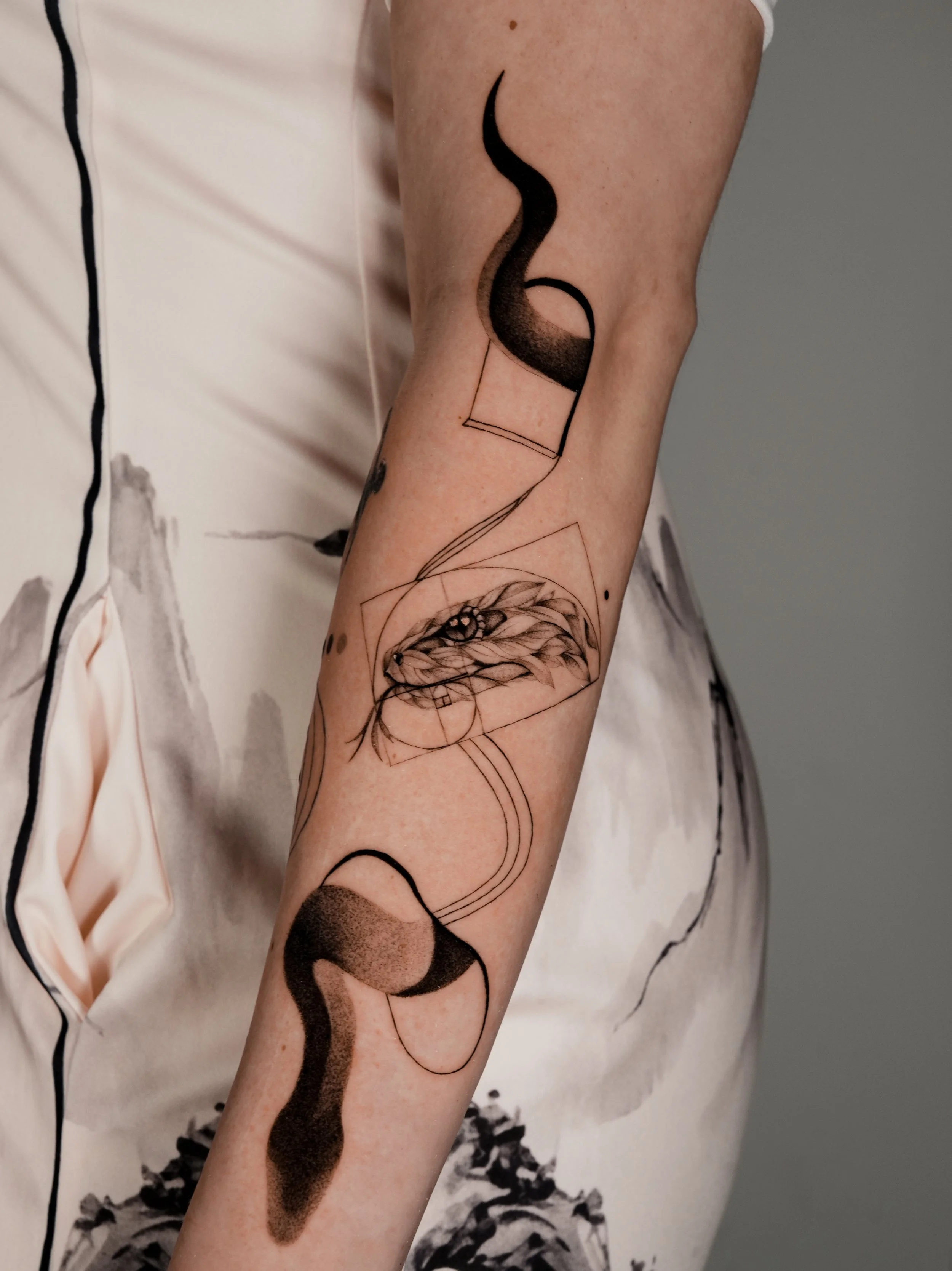 Abstract Micro-Realism Fine Line Dotwork Tattoo of the snake that consist of Leafs