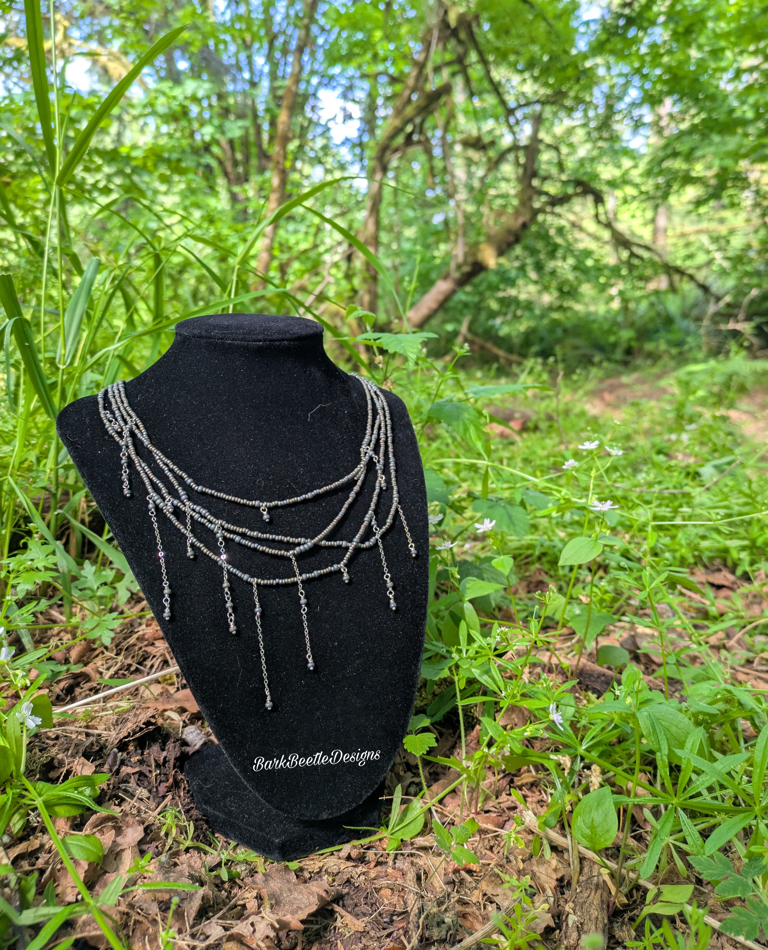 Handmade multi-layered necklace using warm grey seed beads.