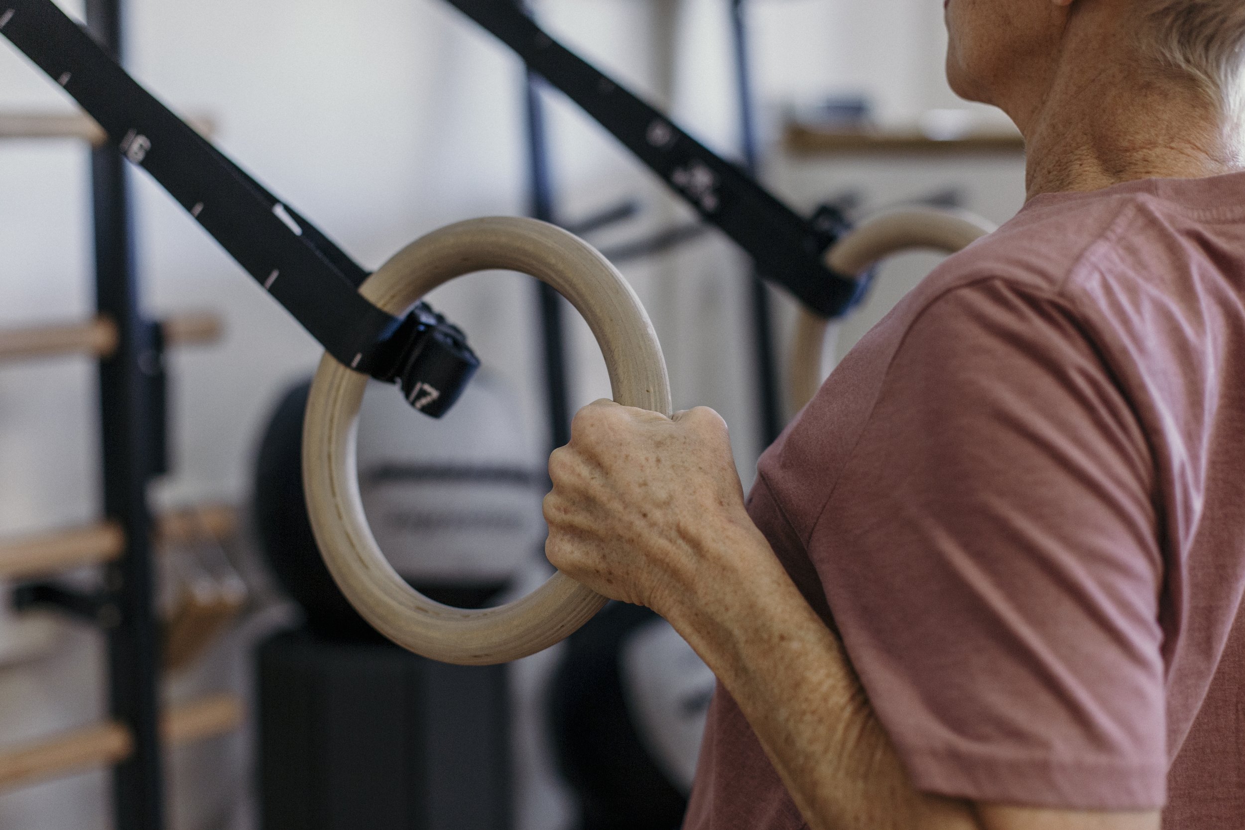 Woman over 60 doing a strength exercise at A50 Personal Training in the South Hills.