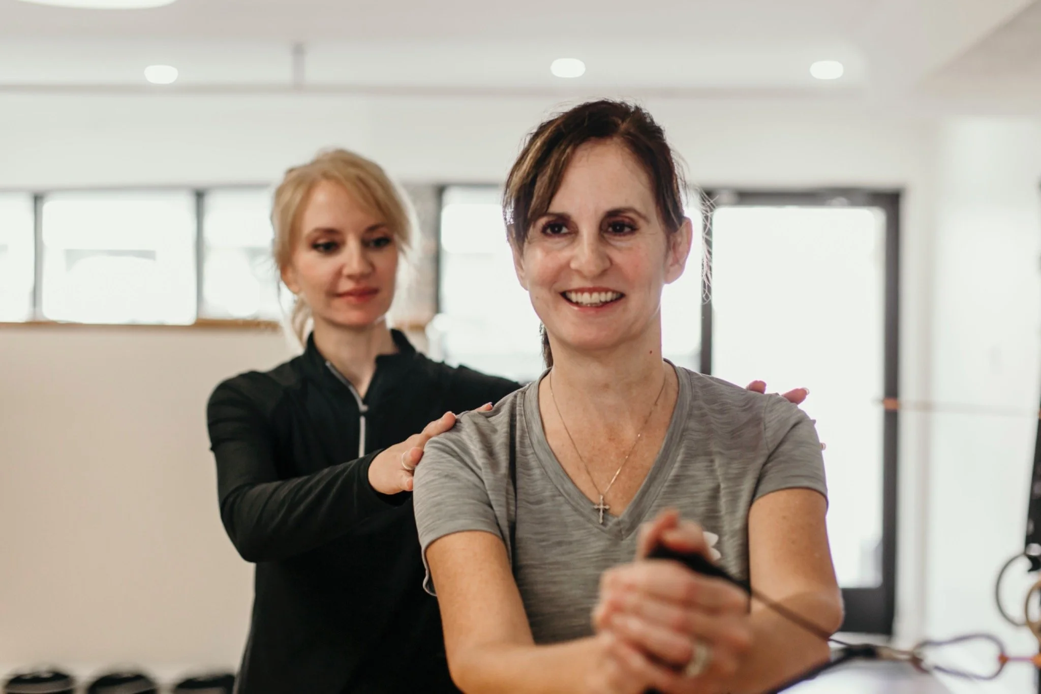 Personal trainer helping woman over 50 build strength at A50 Personal Training near Peters Township