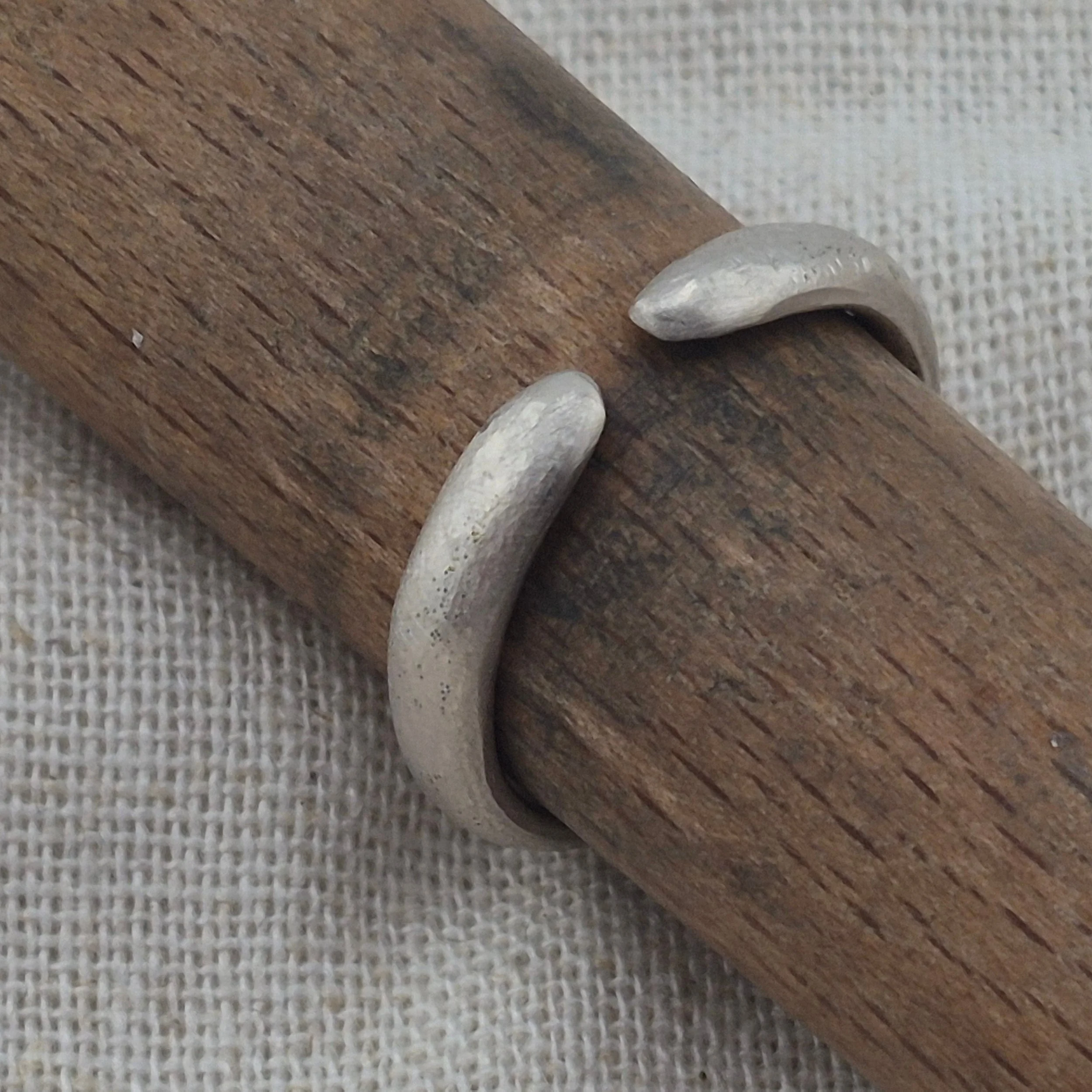 PF017 + PF018

Two AgPd rings, formed from the same piece of metal and finished with their own distinct textures.

Originally a failure, a bracelet in process never fully realized, the material was cut apart and given a second life as two separate ri