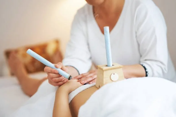 Moxibustion therapy using gentle heat to support circulation, healing, and balance
