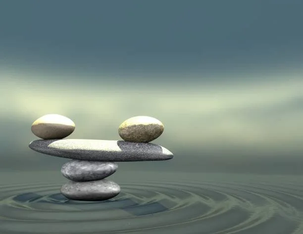 Balanced stone stack representing harmony, healing, and well-being
