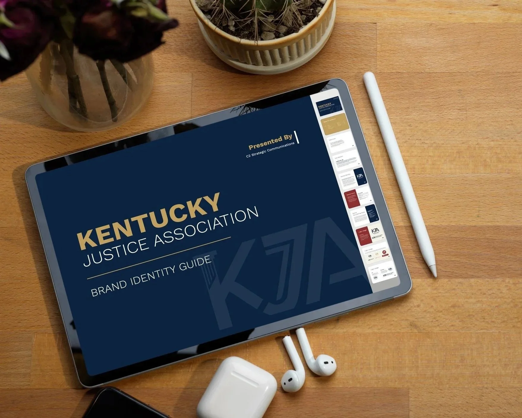 Kentucky Justice Association brand guide tablet display on desk