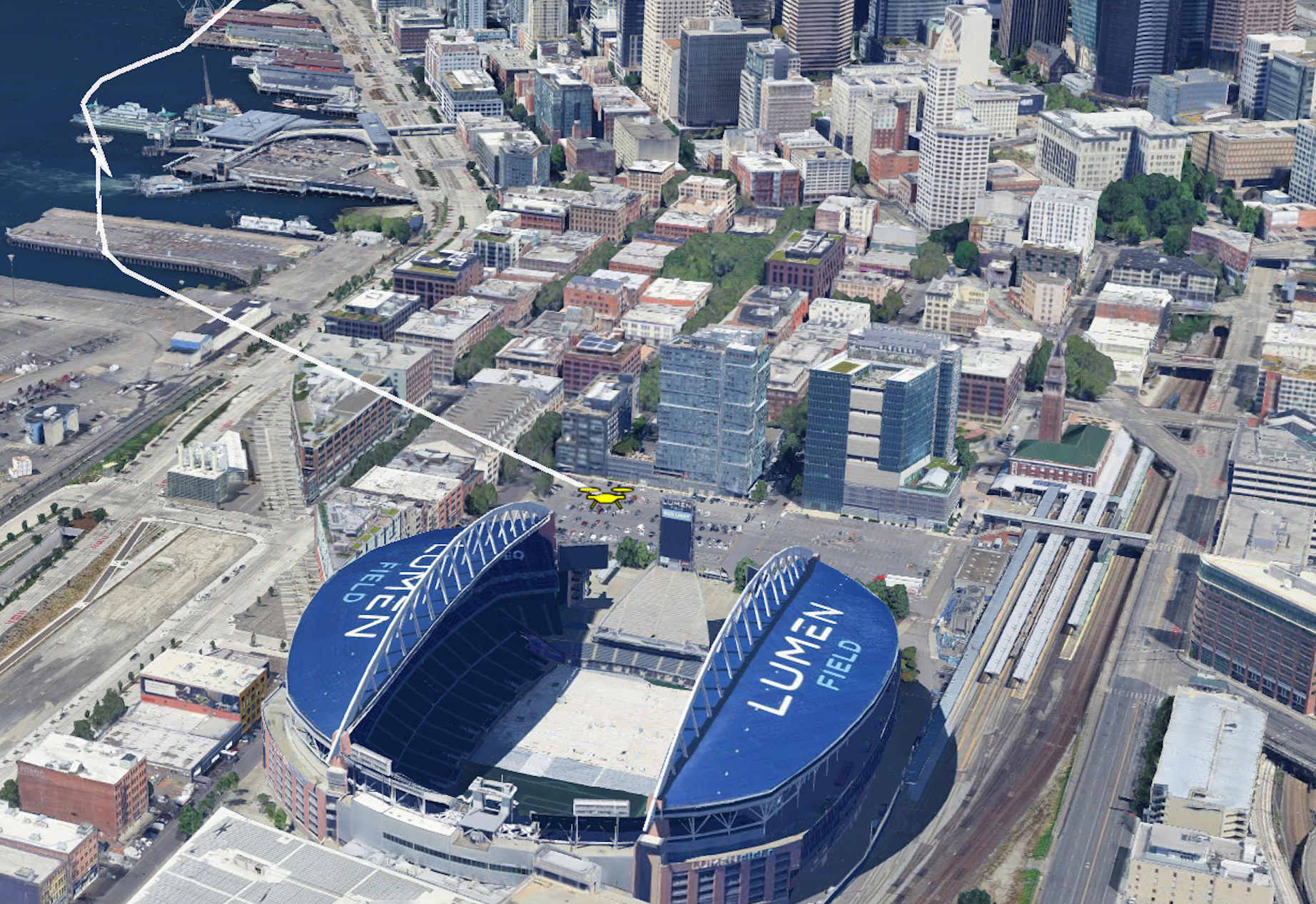 Aerial view of Lumen Field in Seattle with surrounding city buildings, showing a drone flying above that was detected, tracked, and identified by Pierce Aerospace's Remote ID sensors.