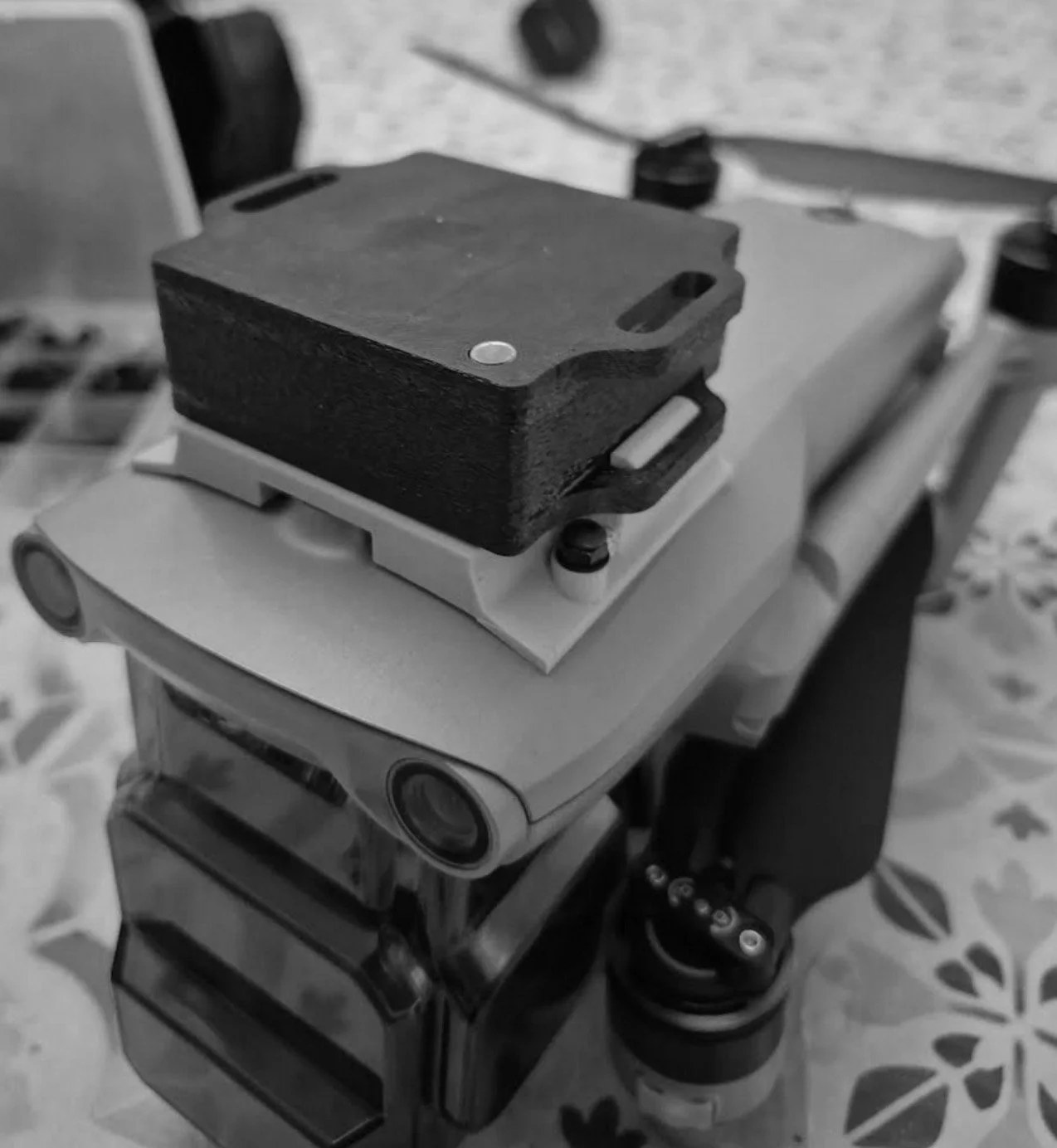 Pierce Aerospace's R2T tactical Remote ID sensor mounted on top of a drone. A R2T can turn an existing drone into an AWACS, providing airborne Remote ID detection and tracking capabilities.