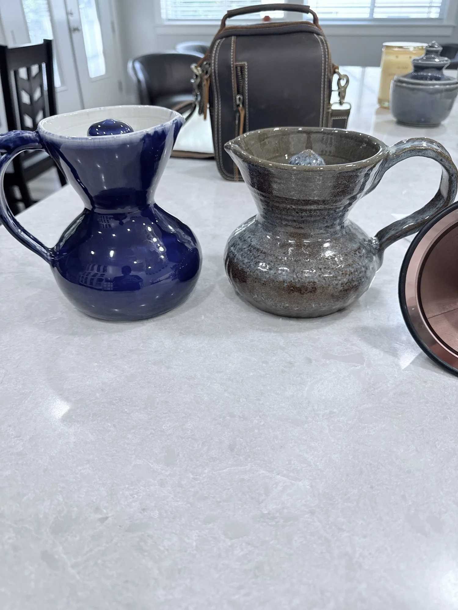 Cobalt and bronze pour-over coffee pitchers, 2026