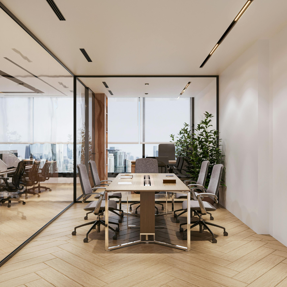 Modern office conference room with a wooden table, eight chairs, large windows, and a city view, decorated with green plants.