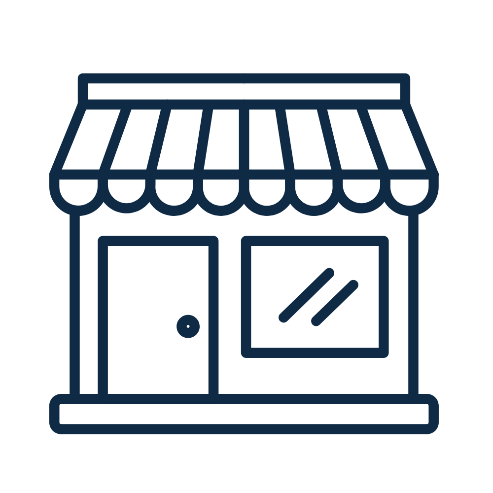 Line drawing of a small shop with an awning, a door, and a window.