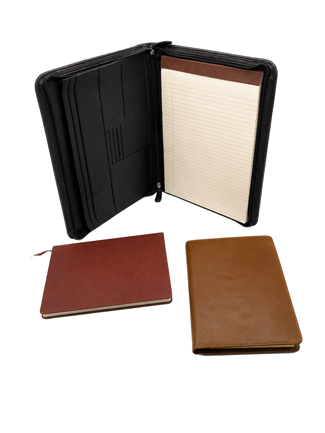 Open black leather zippered planner or portfolio with lined notepad inside, and two closed notebooks in brown and tan leather covers placed in front.