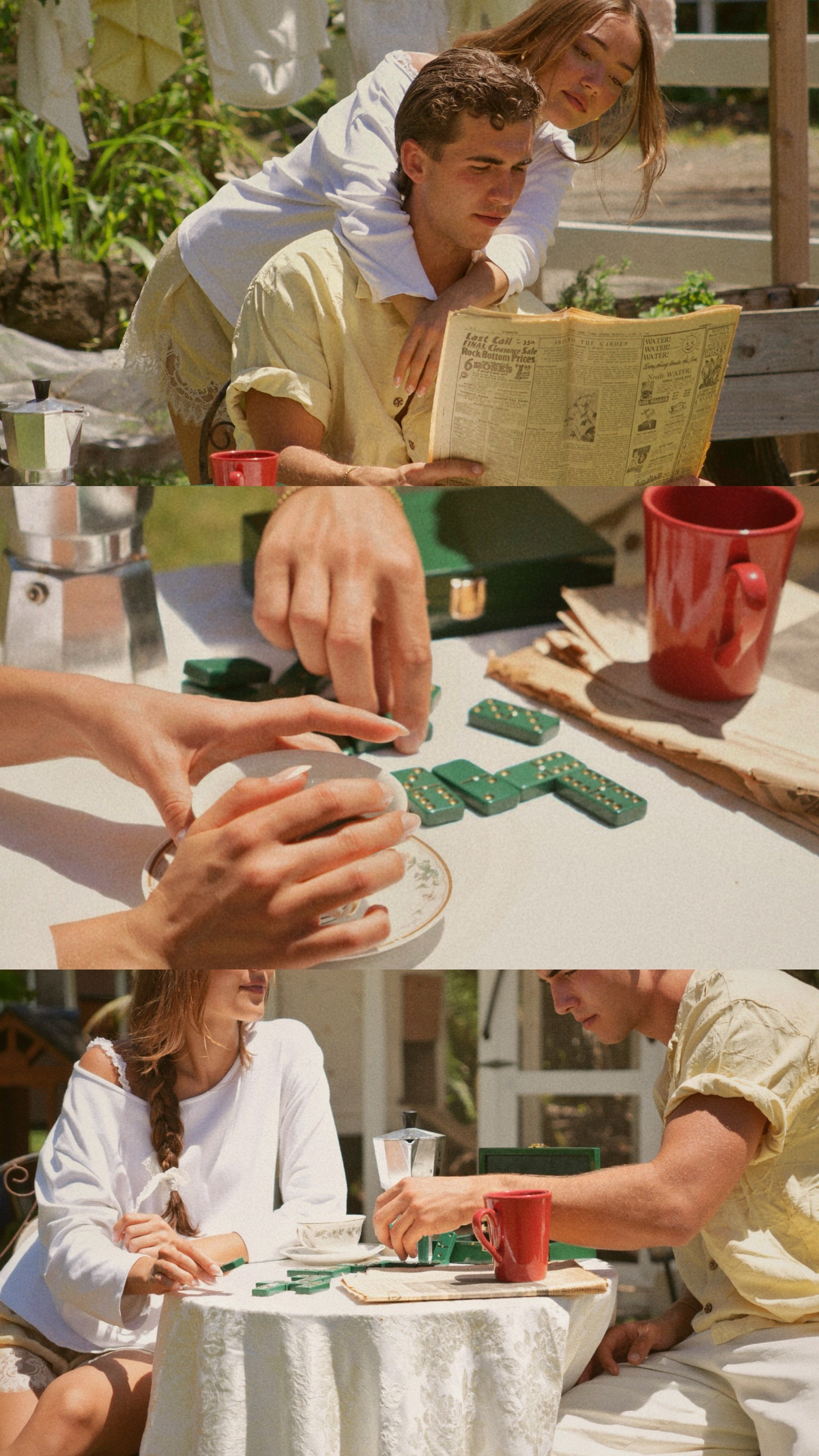 A man and woman playing dominoes at an outdoor table, with a woman sitting nearby watching, on a sunny day.