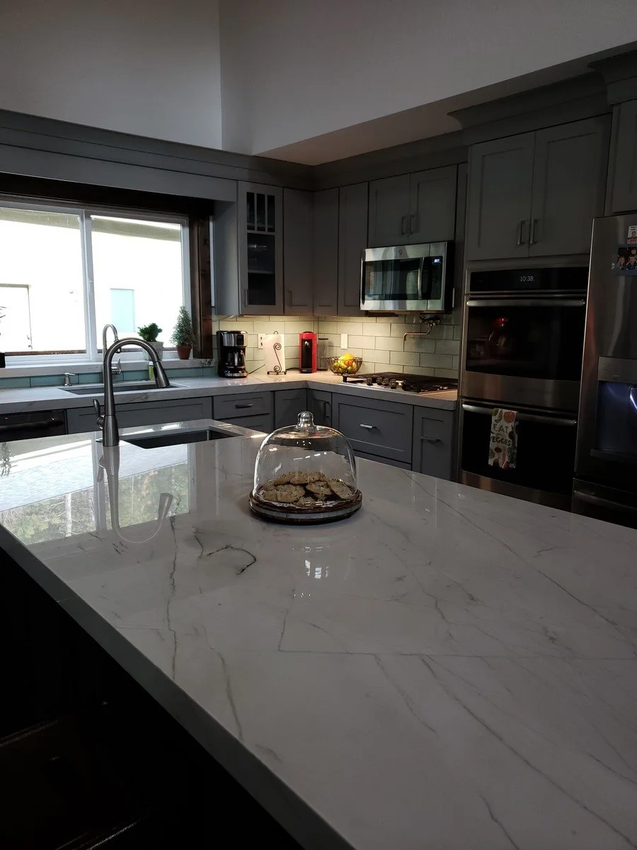 Modern kitchen with gray cabinets. We offer affordable residential design services in Idaho, including cities such as Boise, Meridian, Eagle, Kuna, McCall, Cascade, Caldwell, Melba, Middleton, Star, Horseshoe Bend, Emmett, and Marsing.