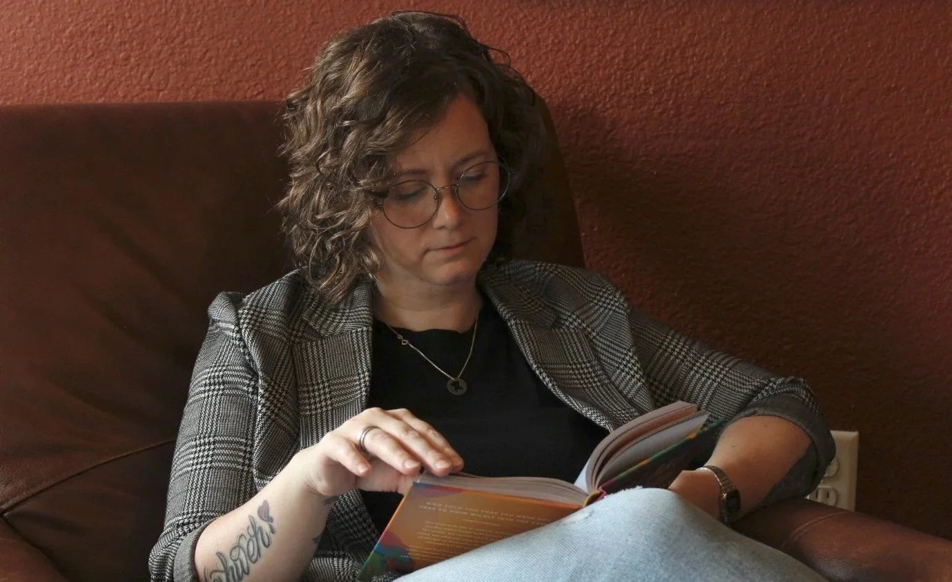 Kalli Stout young-adult-counseling-support.jpgreading a book in a cozy chair, representing a thoughtful and welcoming counseling space for young adults in Weatherford, Texas.