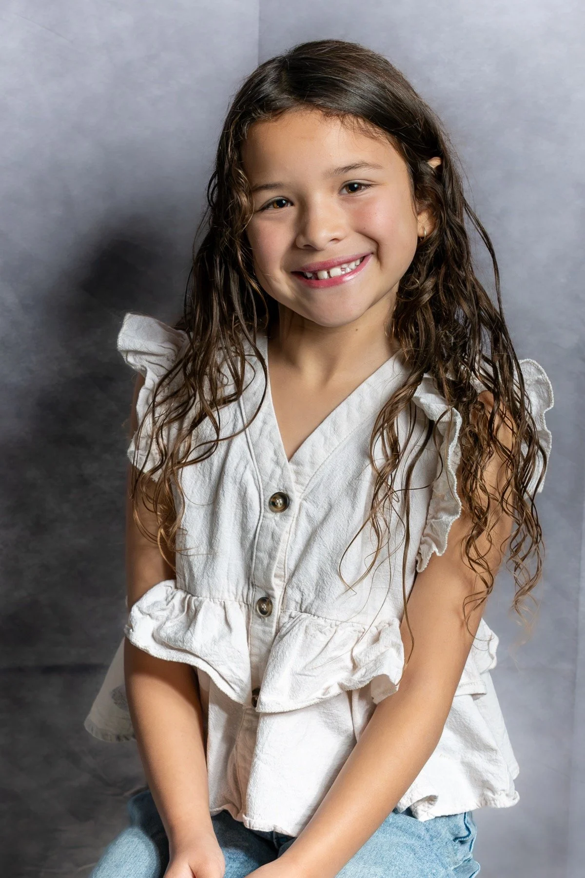 Young athlete smiling during a studio portrait session
