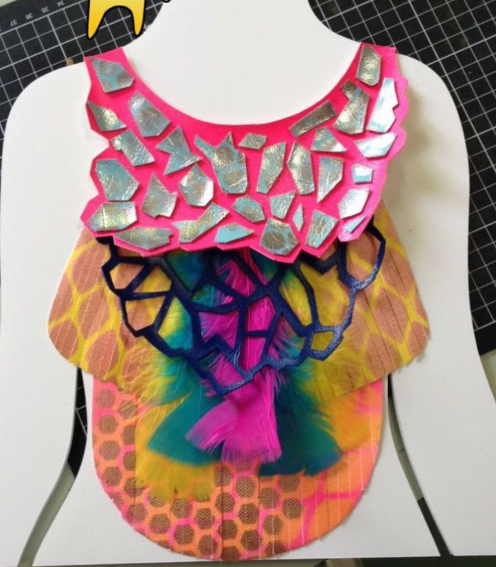Statement piece necklace, linoleum material, spray paint, feathers, and chain. 2018