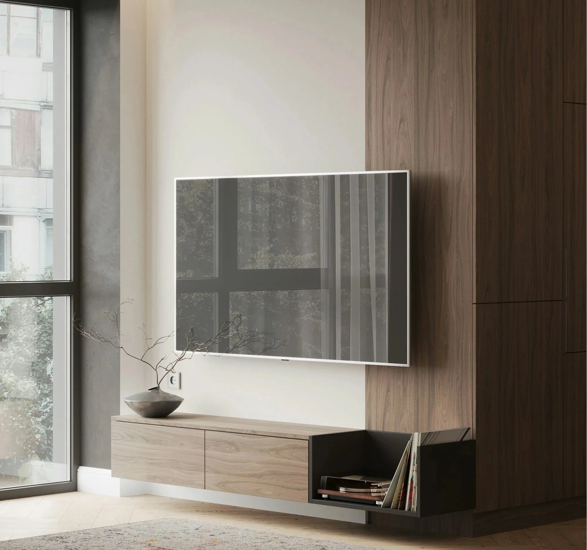 Modern interior with large, sleek, mounted TV, hidden in-wall wires, wooden cabinet, a minimalist gray vase with branches, a window with a city view, and a hanging bookshelf with books.