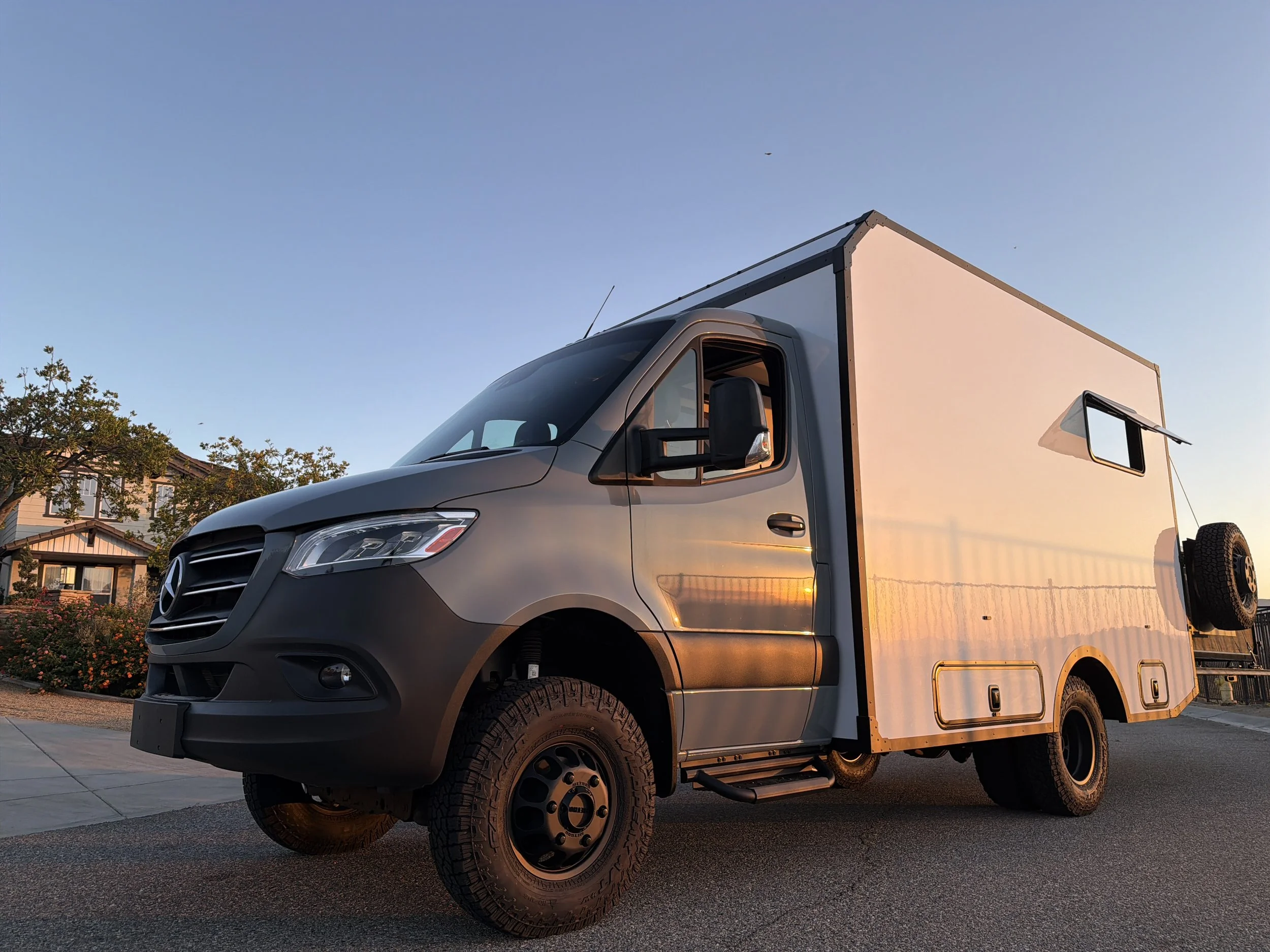 A ModBoxRV parked on the driveway during the golden hour. We took this Modbox to our first trade show!