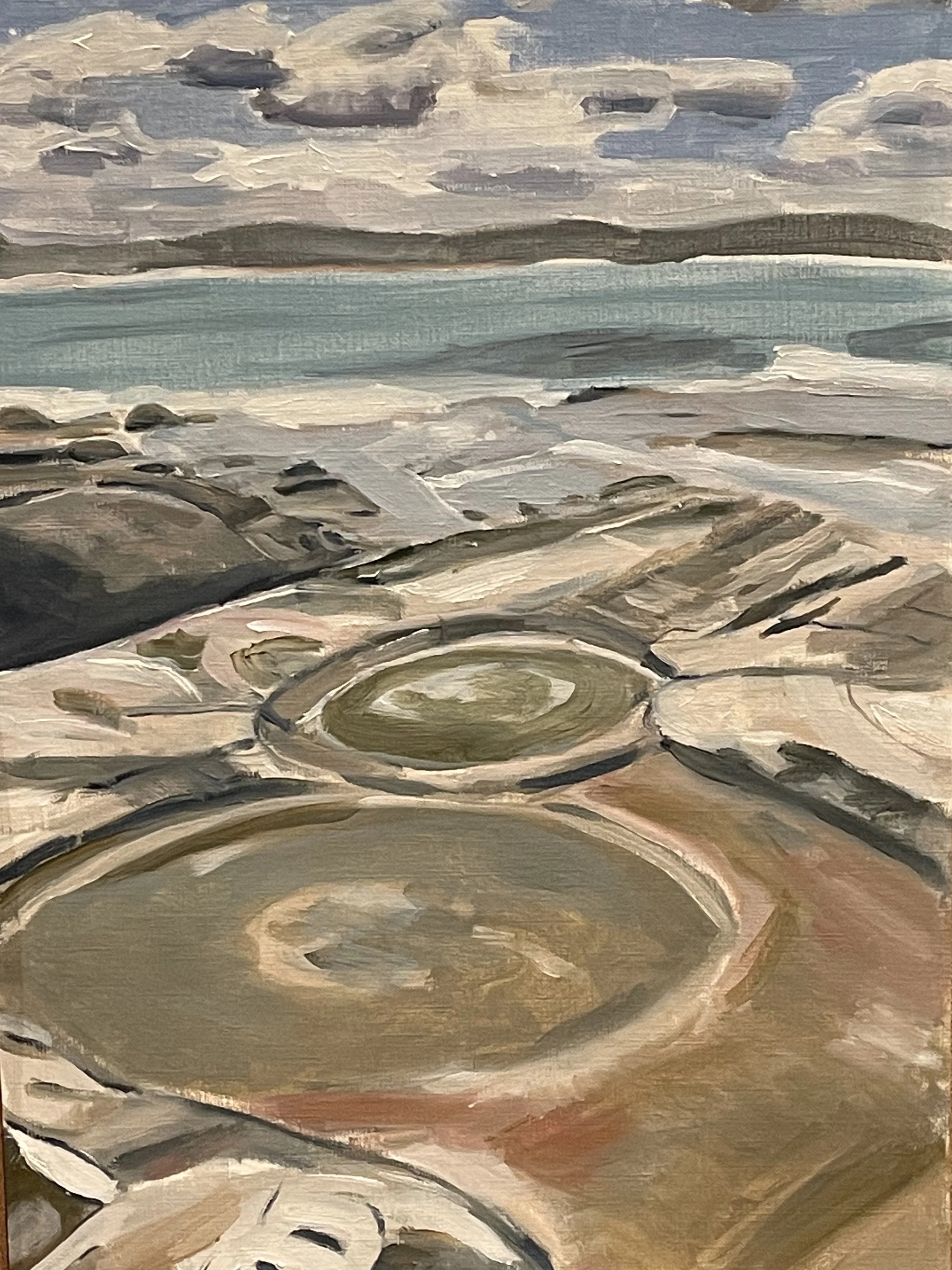 A landscape painting of a rocky shoreline with a cloudy sky and an ocean in the background, painted in an impressionist style.