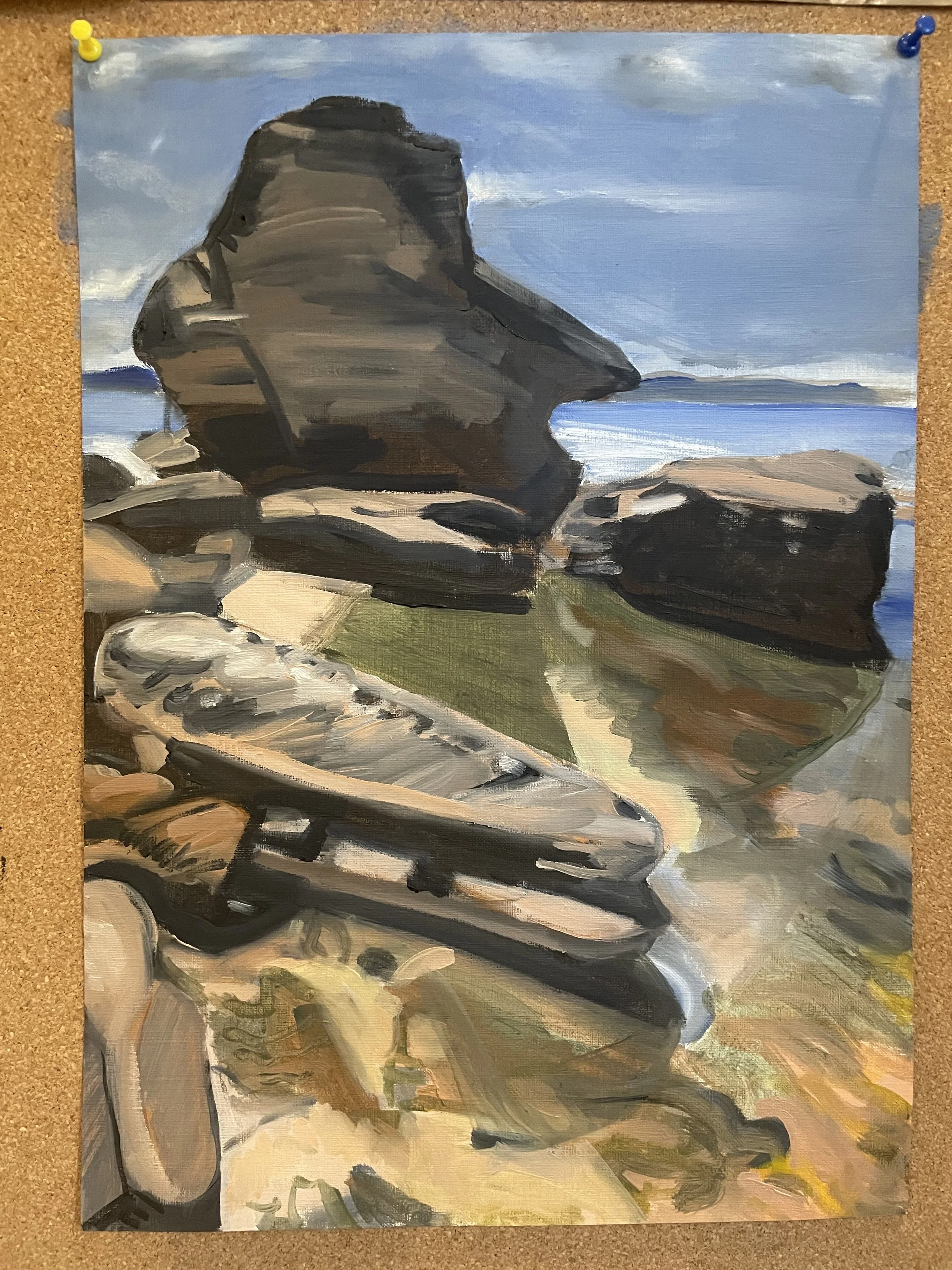 A landscape painting depicting large rock formations by the water under a cloudy sky, with a gravel path in the foreground.