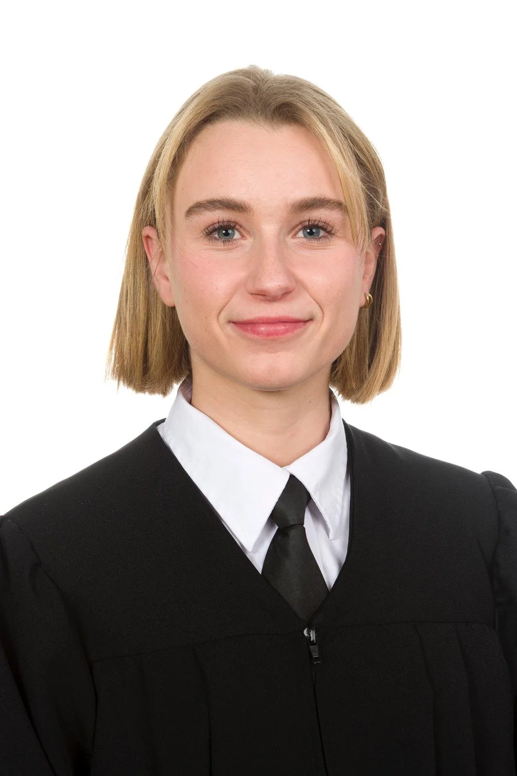 Young woman with blonde hair wearing a black judge's robe and white shirt, smiling.