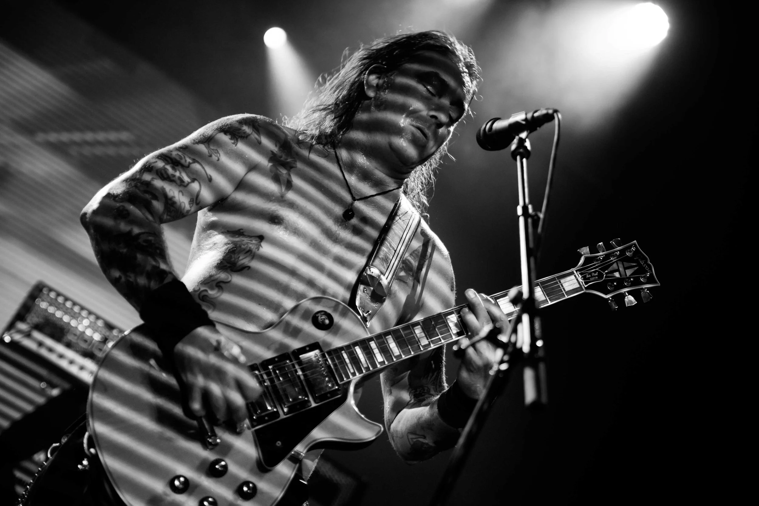 High on Fire - Shot by Shotison. Matt Pike playing an electric guitar on stage under spotlight lighting.