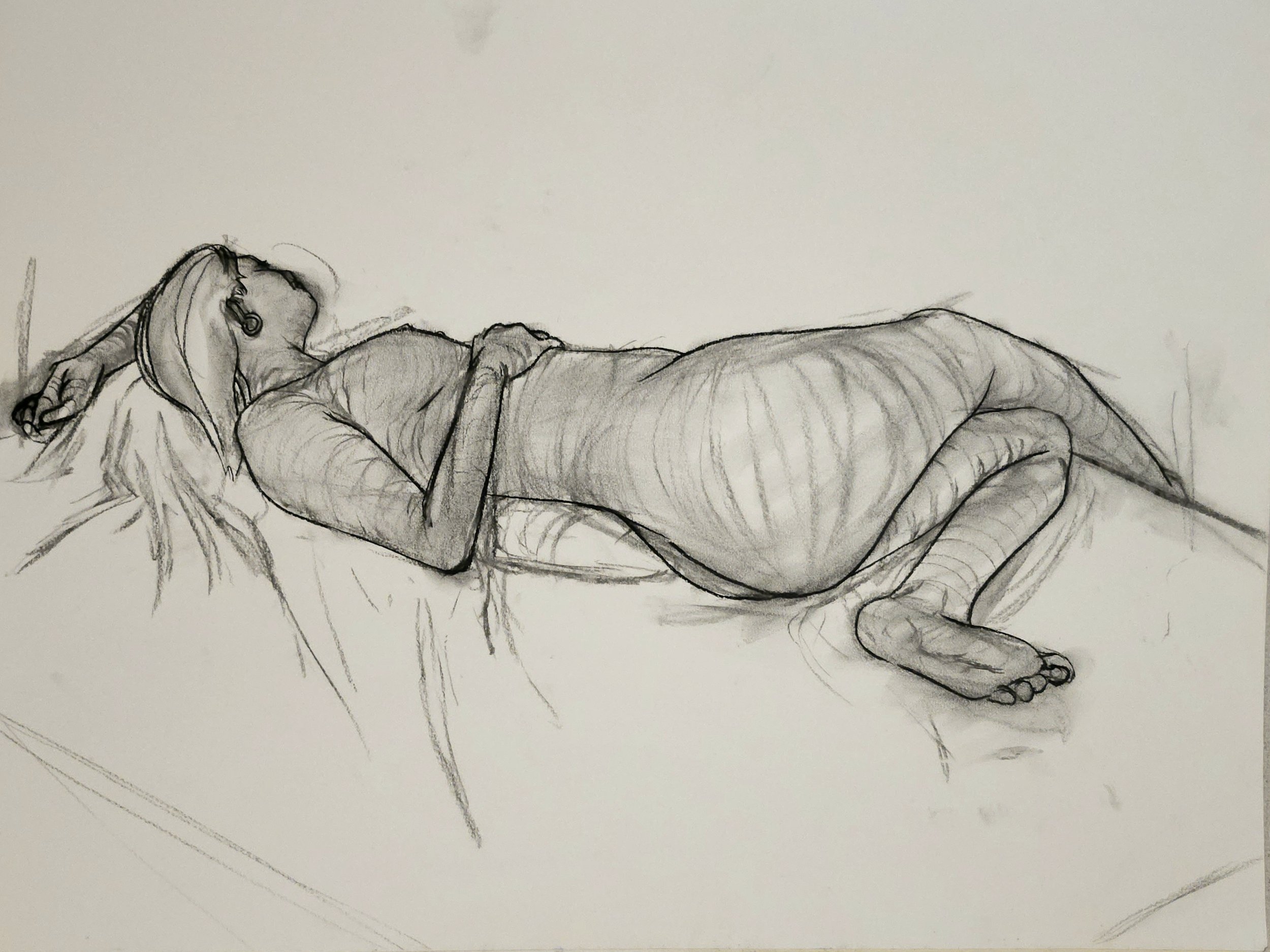 A sketch of a woman lying down on her side with closed eyes, wearing earrings, with her arms resting by her head and legs slightly bent.