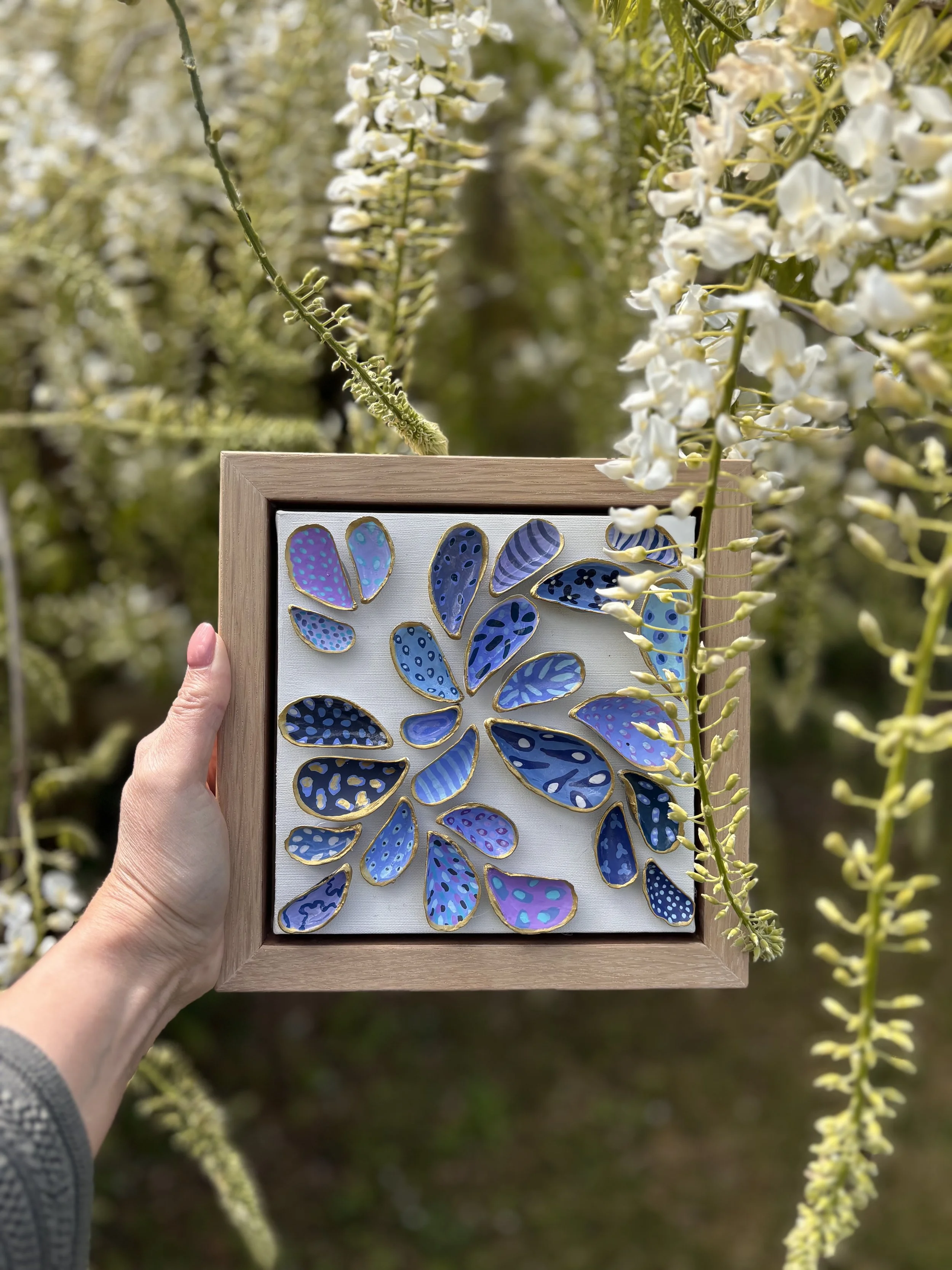 Charity auction shell artwork with textured painted mussel shells