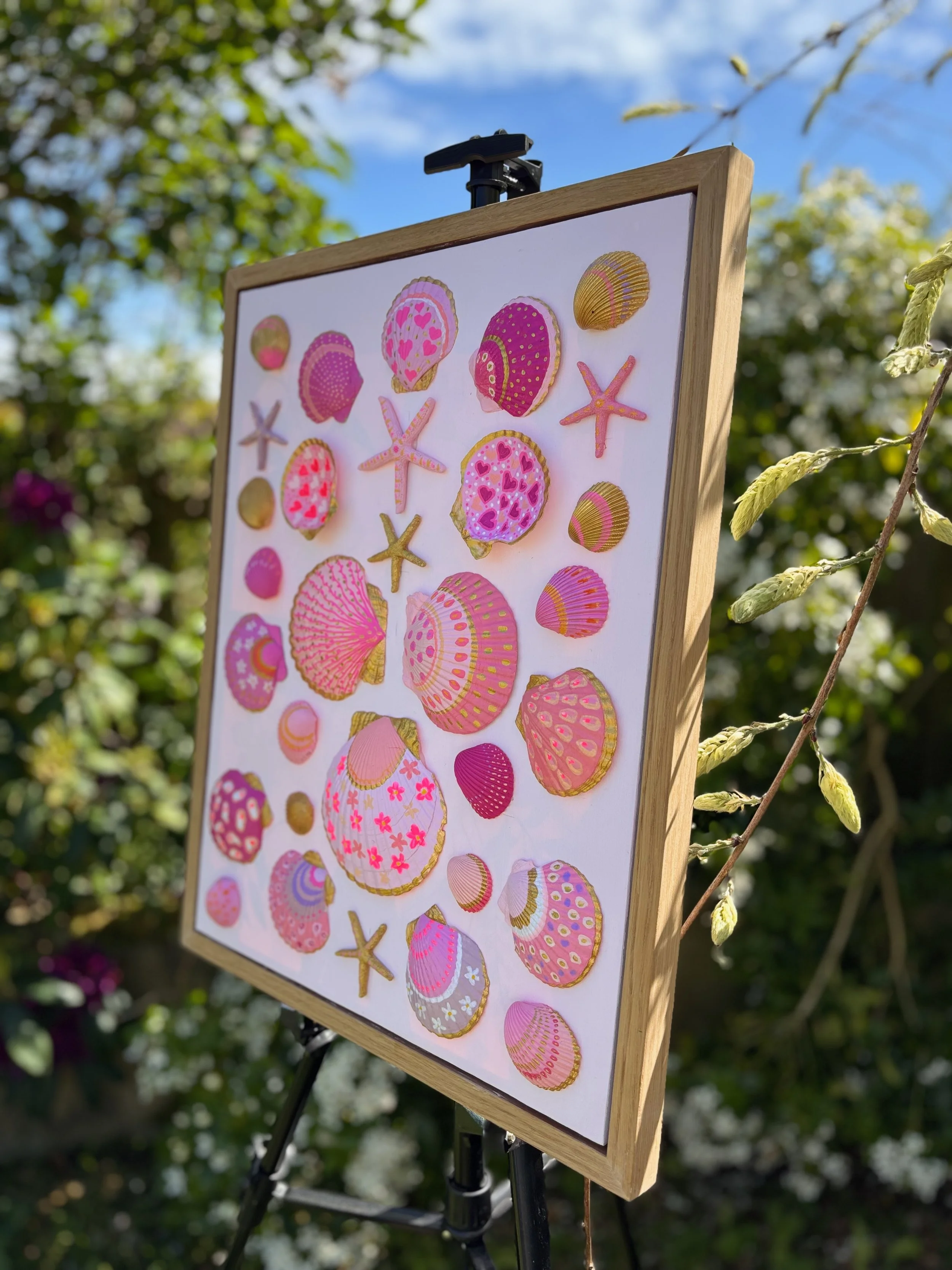 Ocean inspired shell and starfish art in oak frame