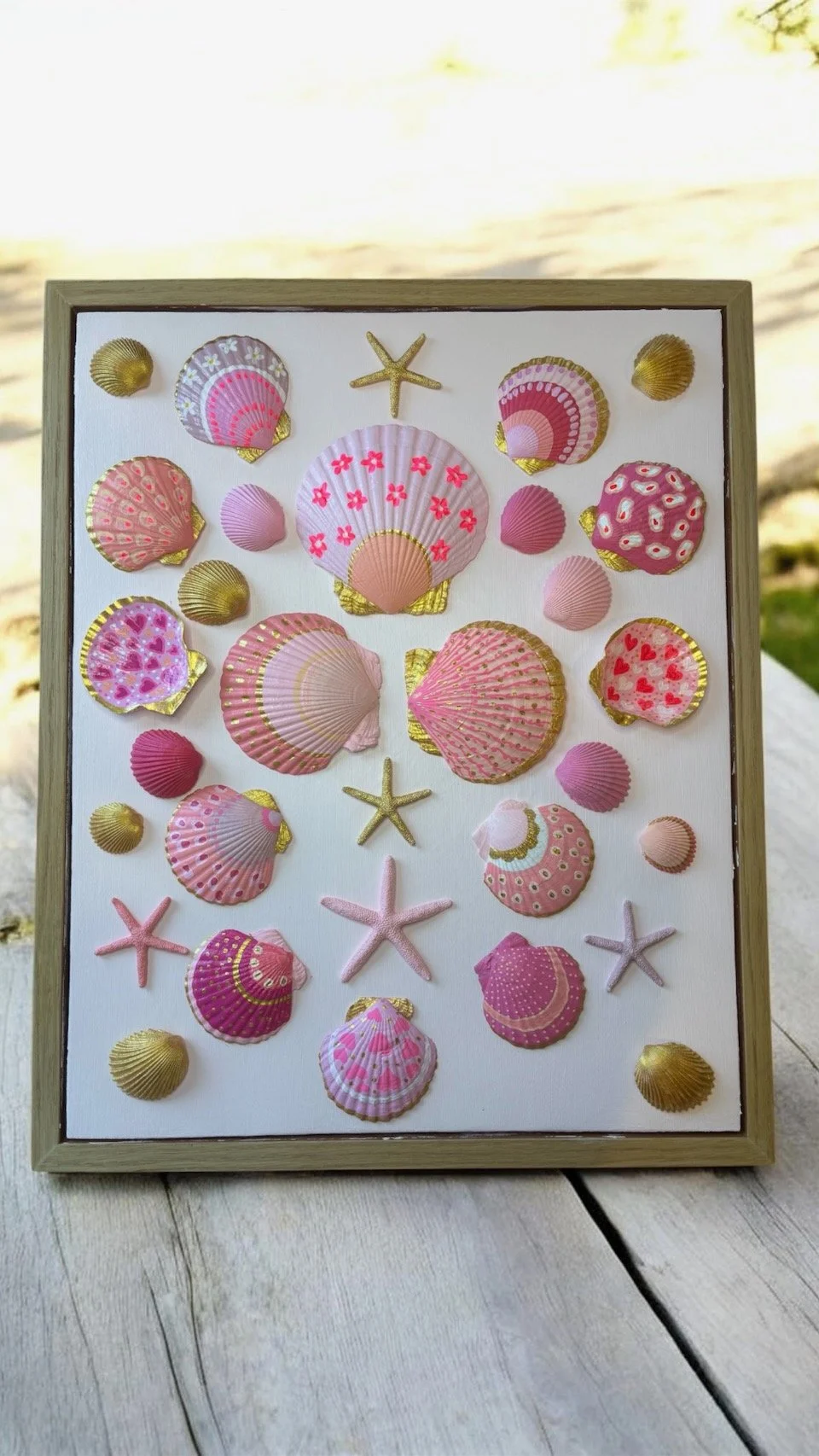 Pink and gold shell wall art with hand painted seashells and starfish