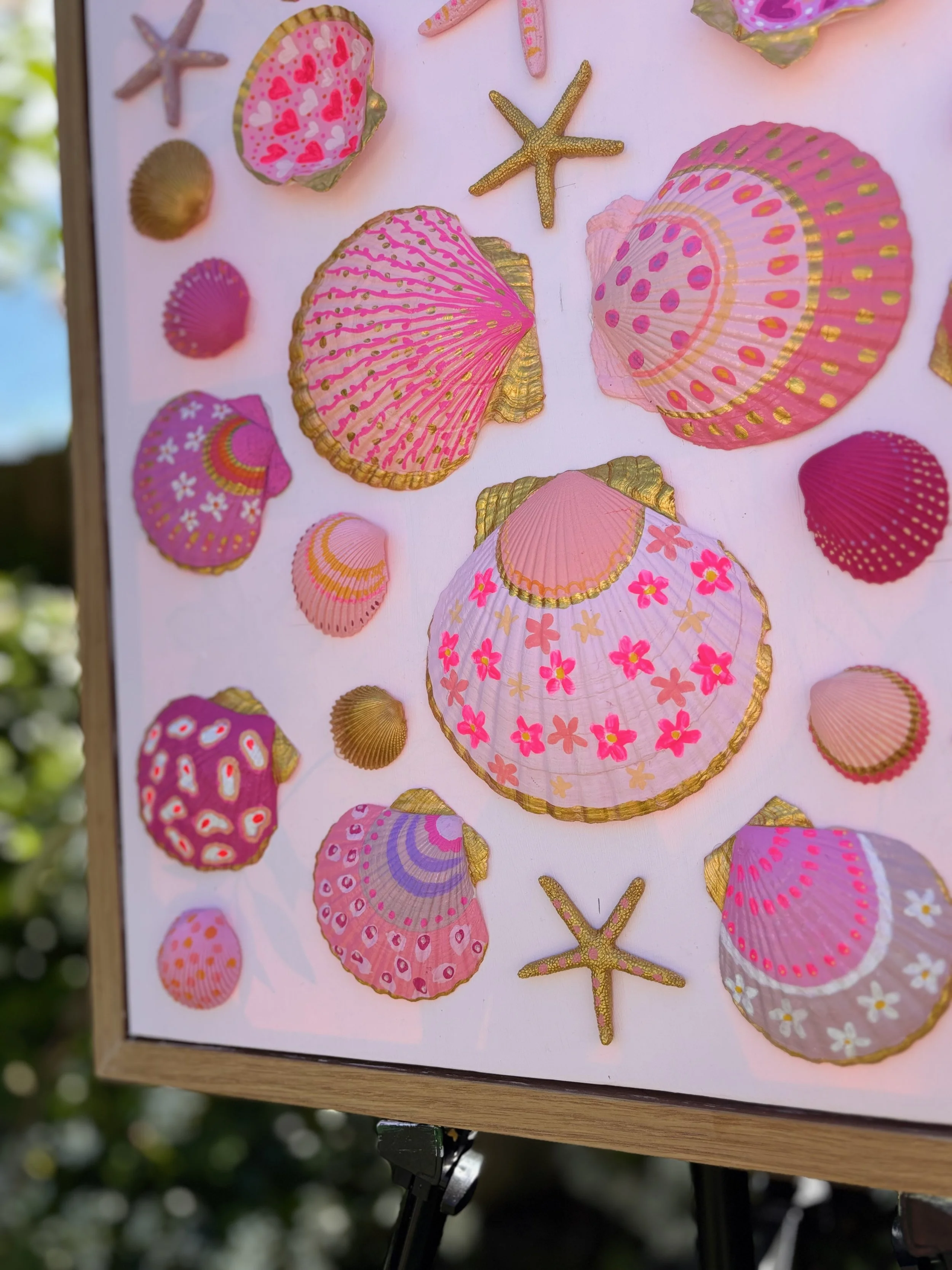 Ocean inspired shell and starfish art in oak frame
