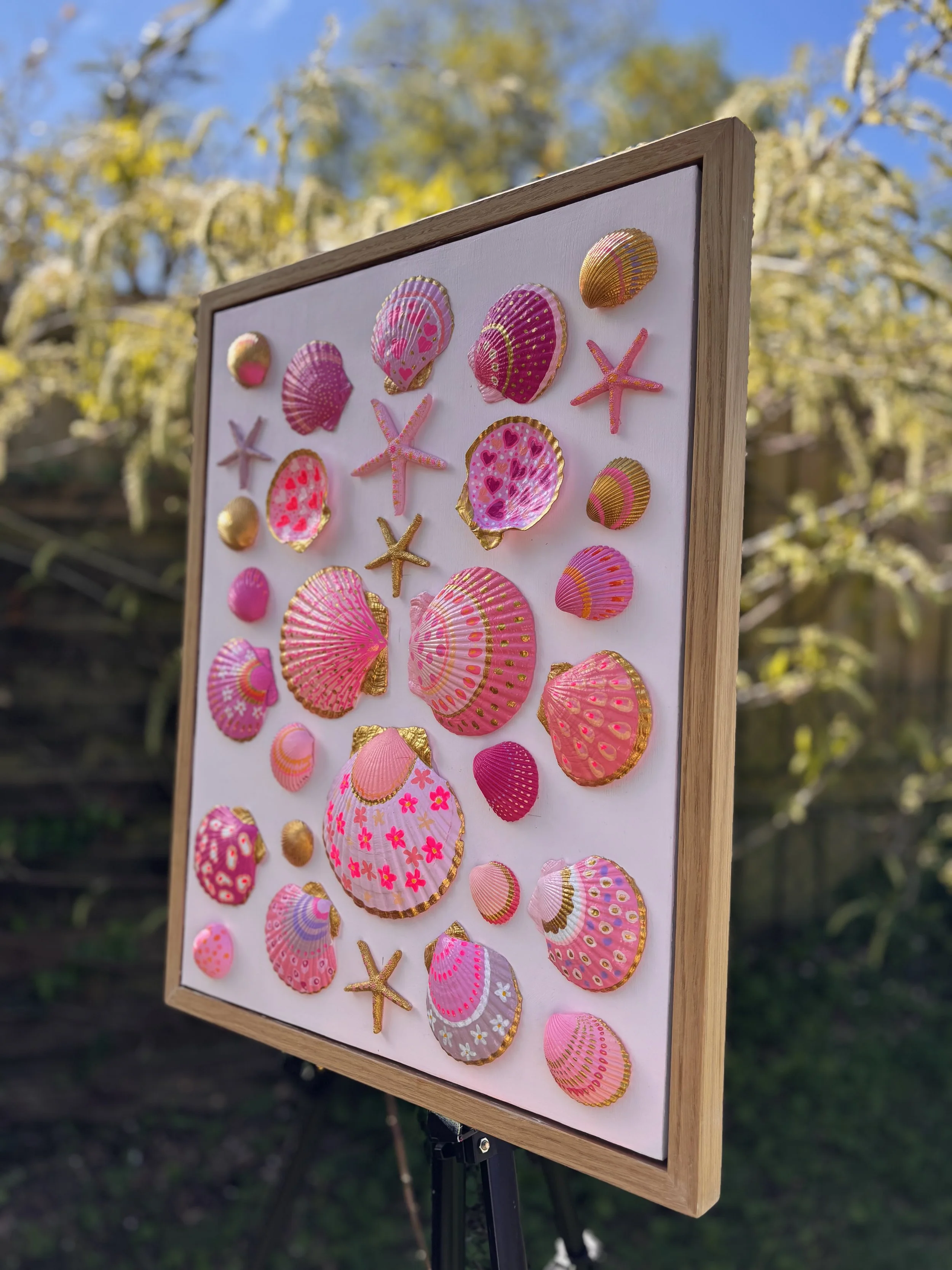 Pink and gold shell wall art with hand painted seashells and starfish