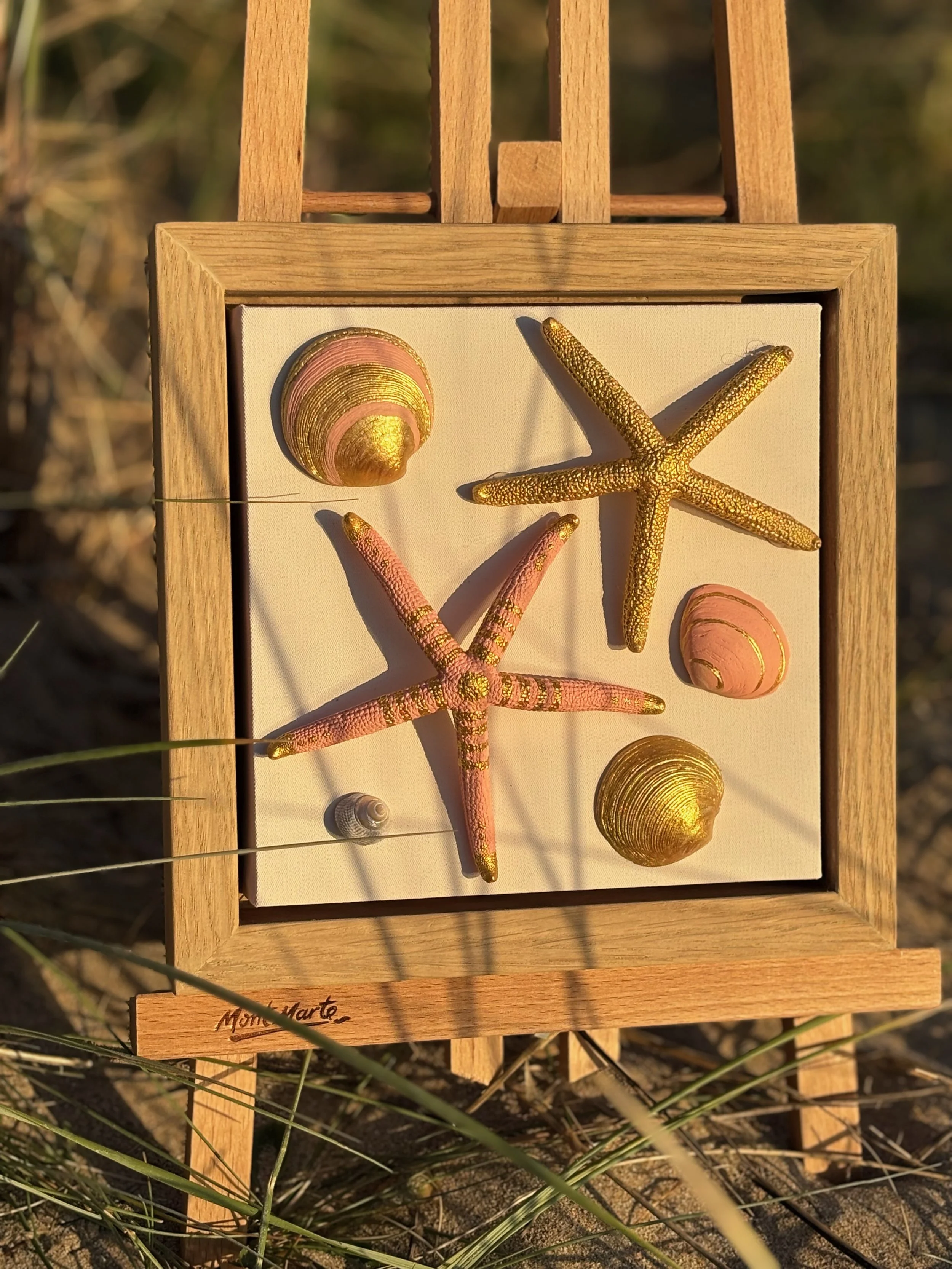 Delicate shell and starfish art in soft pink tones