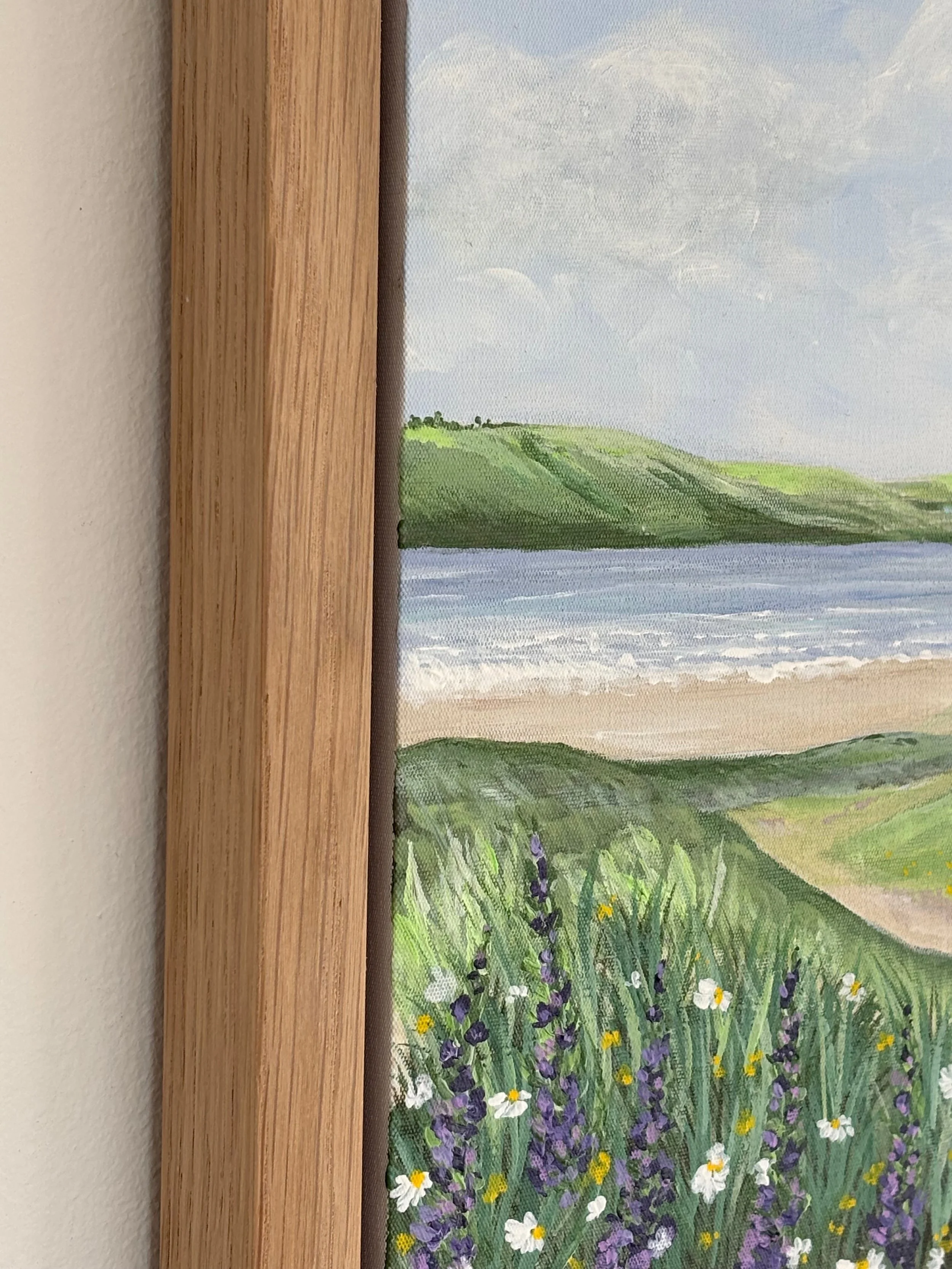 Rock to Tregirls original Cornwall coastal painting featuring green fields and calm estuary waters in oak veneer frame