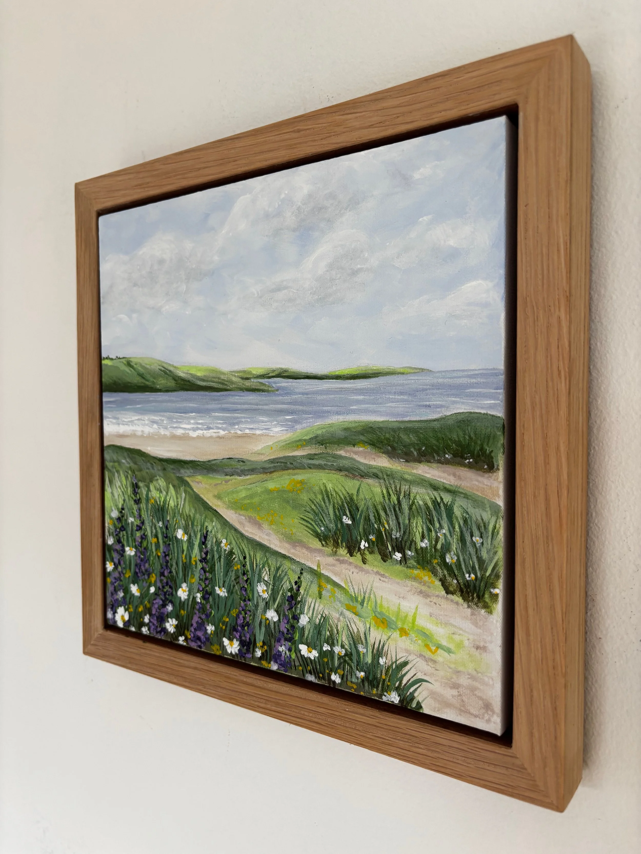 Rock to Tregirls original Cornwall coastal painting featuring green fields and calm estuary waters in oak veneer frame