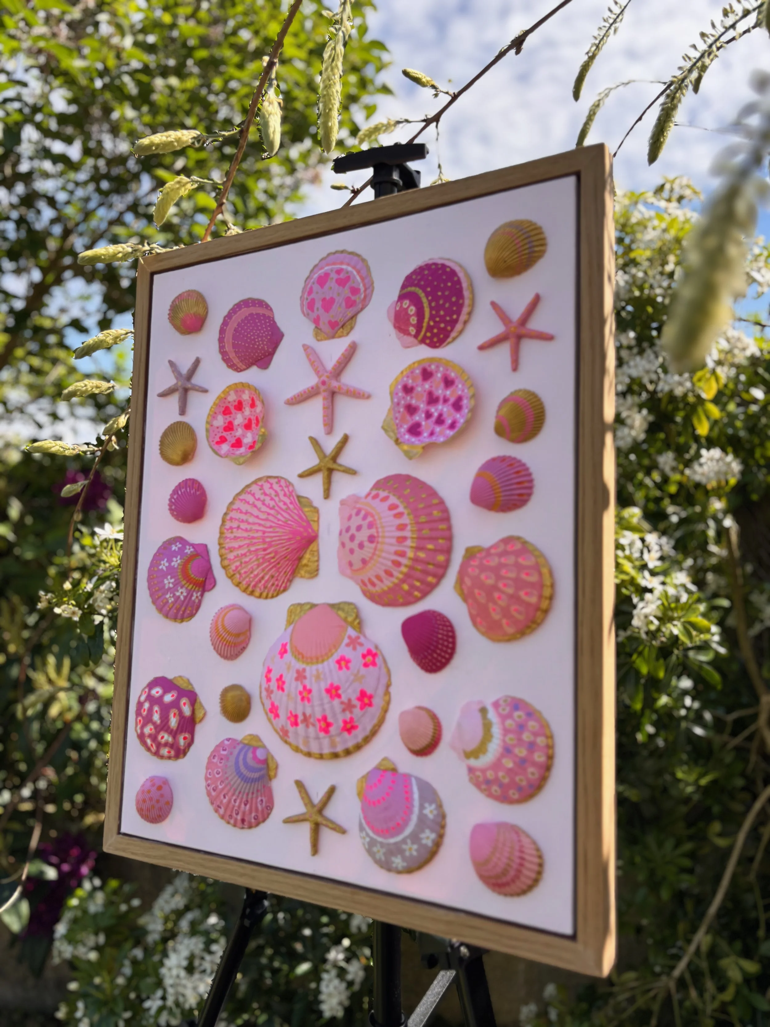 Ocean inspired shell and starfish art in oak frame