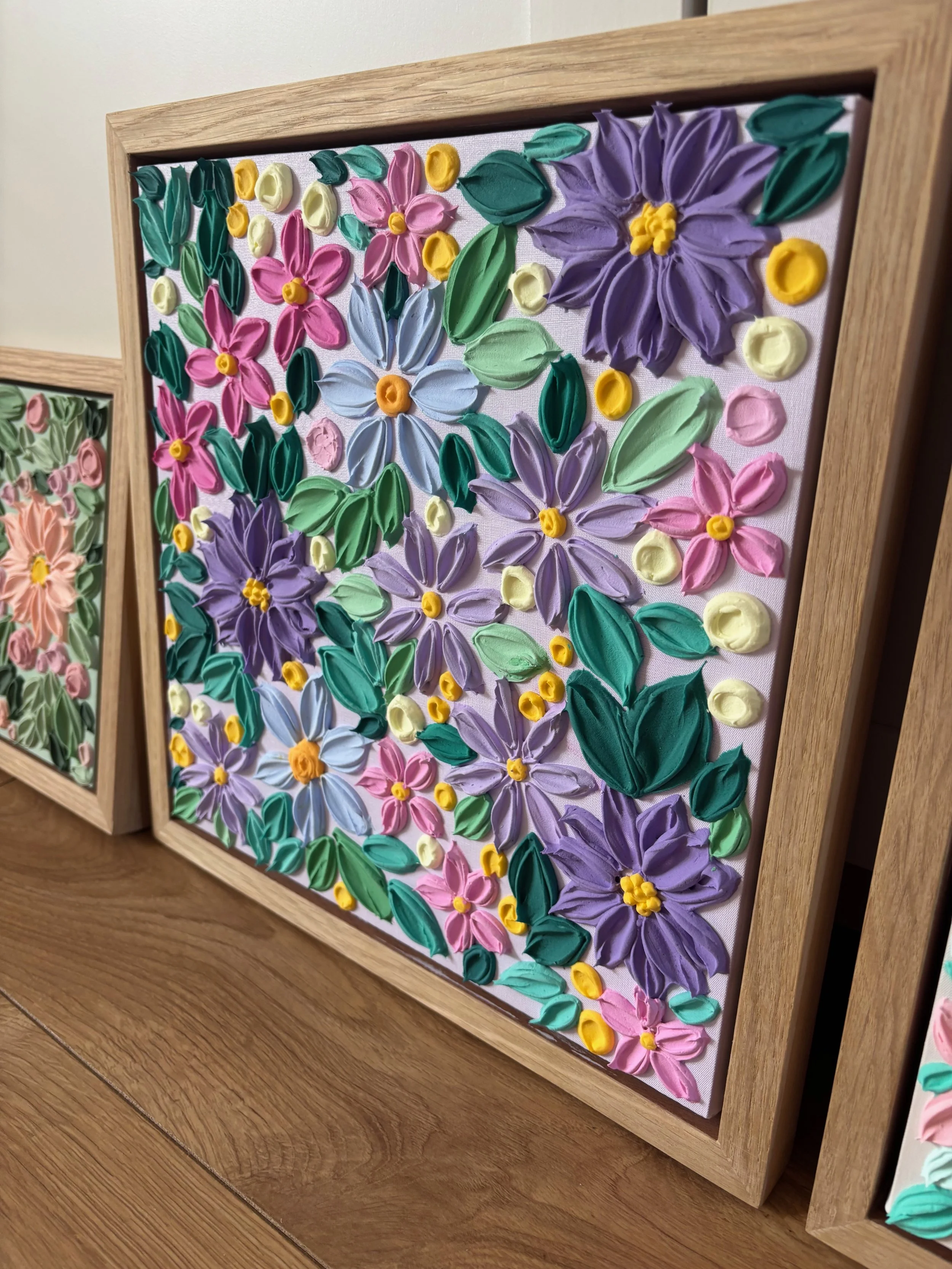 Heavily textured floral canvas featuring pink and violet blooms